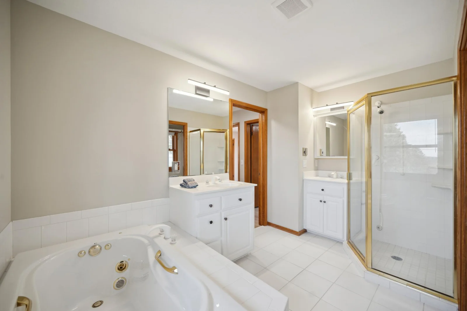 10. Main bathroom which has a  jetted tub and walk in shower plus double sinks