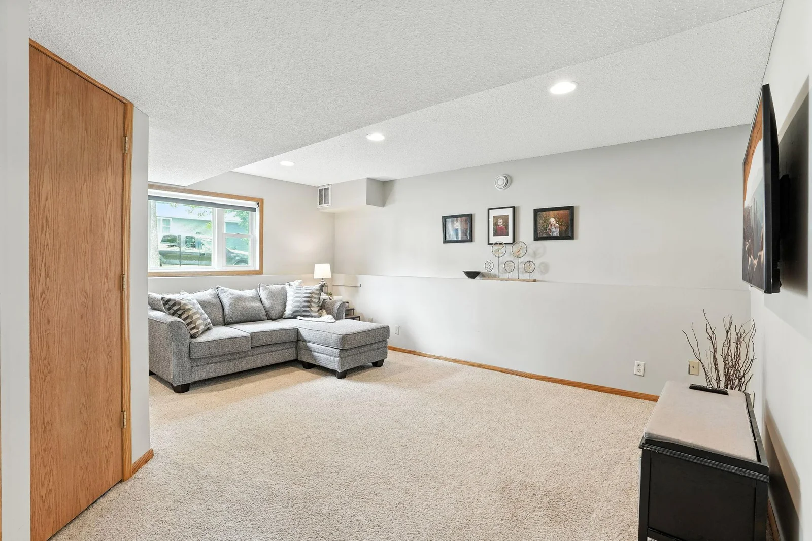 Large lower level family room with newer recessed lighting
