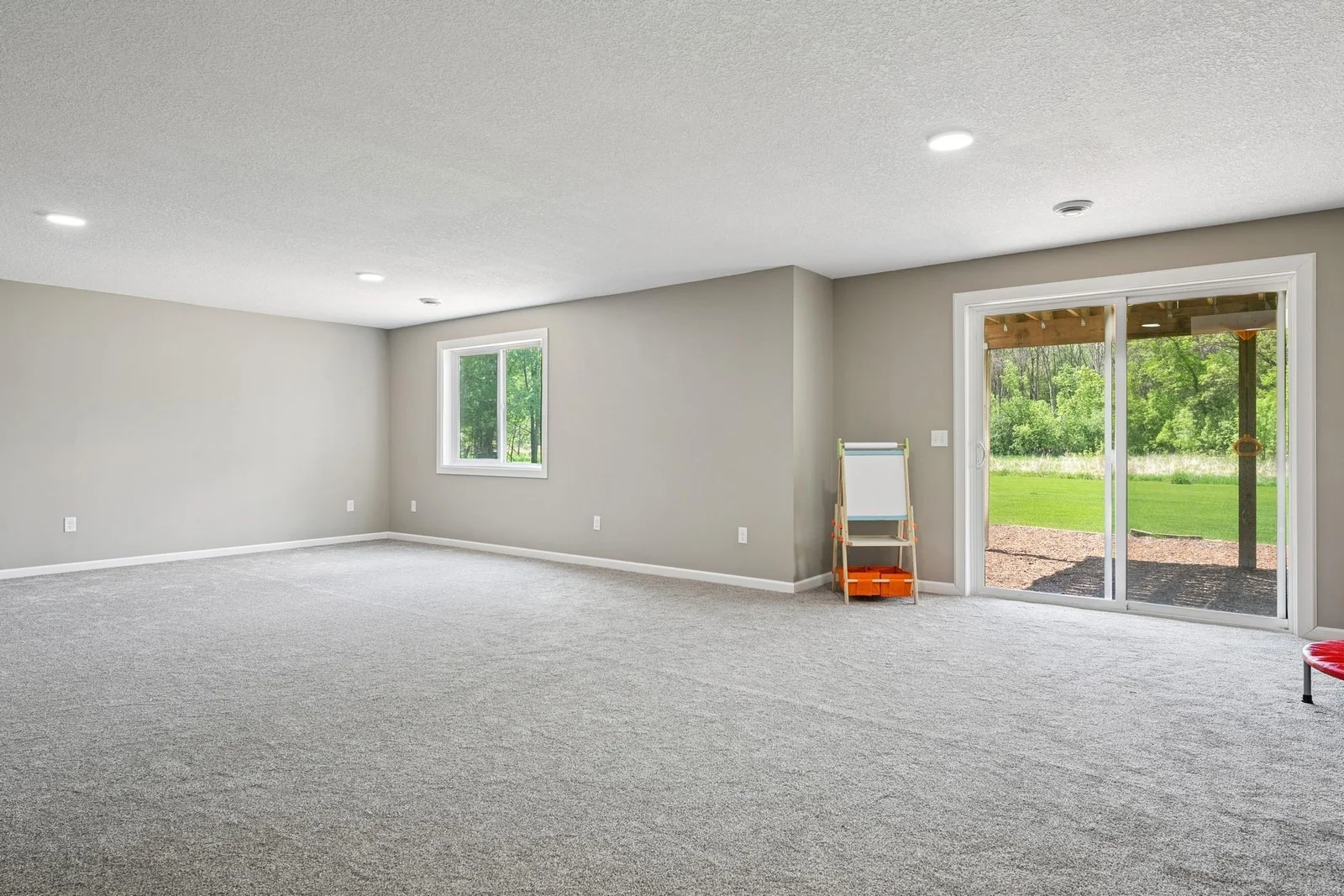 Walkout to the huge backyard. Bright and flexible space.