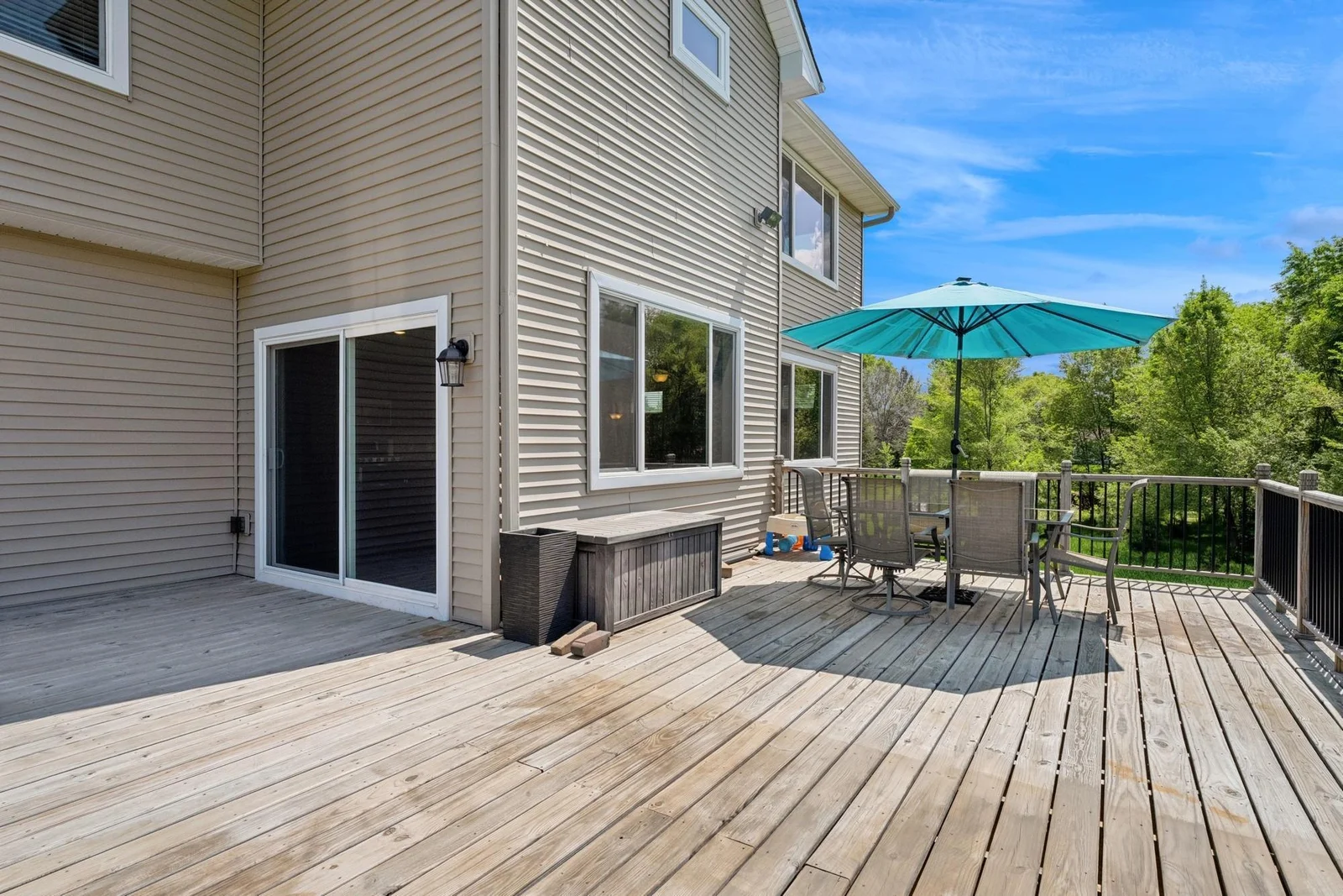 Huge deck just outside of the dining room. Two of the helical piles were installed to support a future 3 or 4 season room outside the sliding glass door.