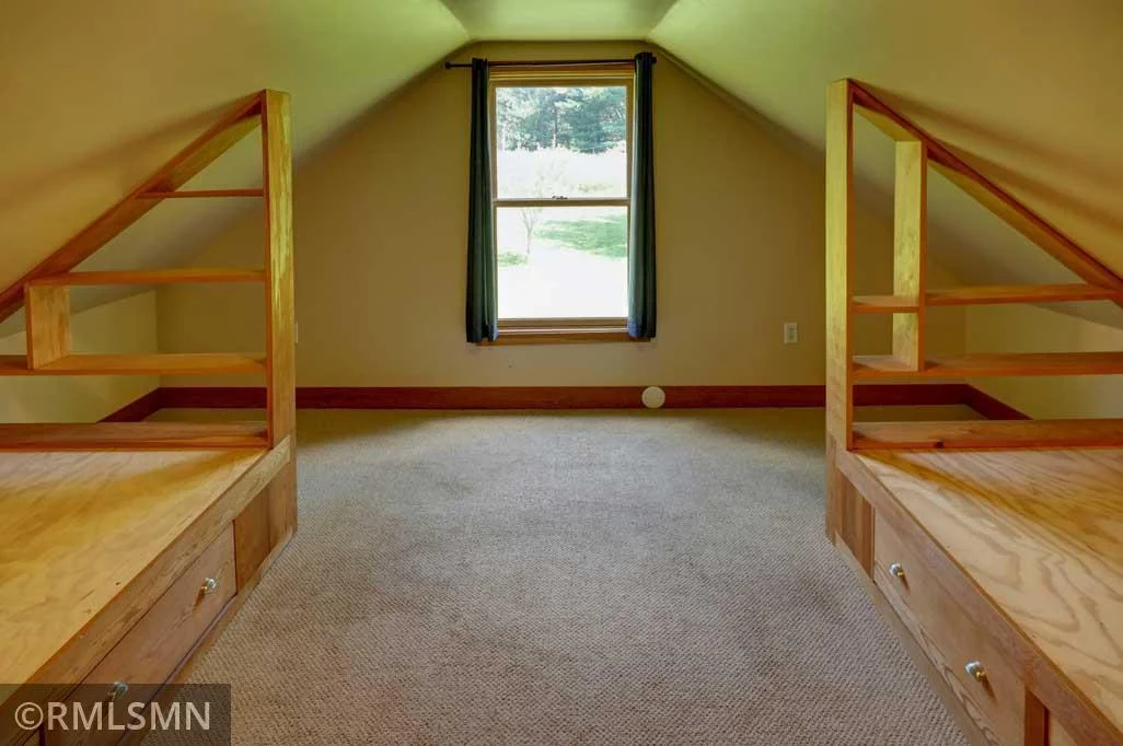 Third upper level bedroom with built in beds.