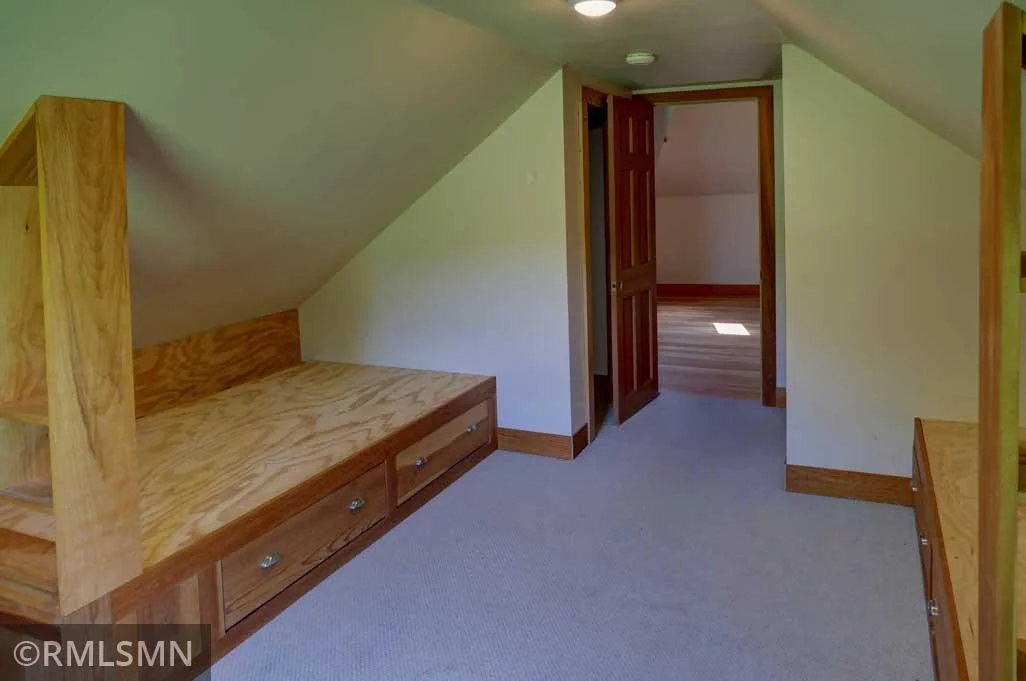 Third upper level bedroom with built in beds.
