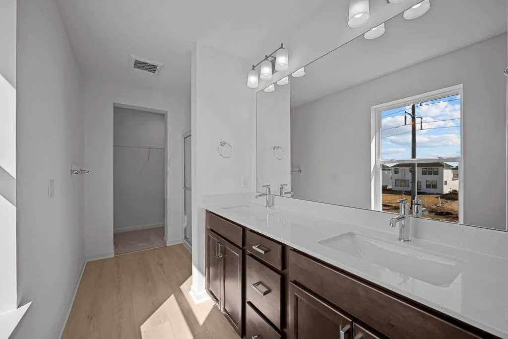 Owner's Bath with comfort height vanity and double sinks.