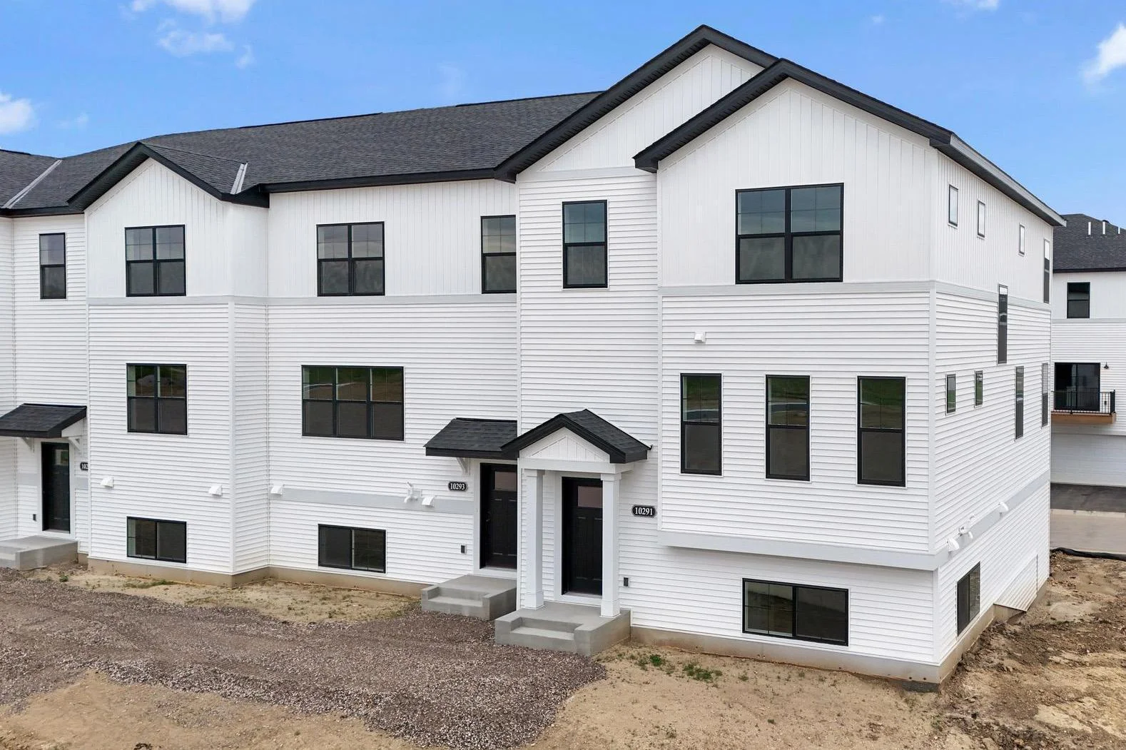 End-unit, front exterior elevation. Landscaping/sidewalks to follow.