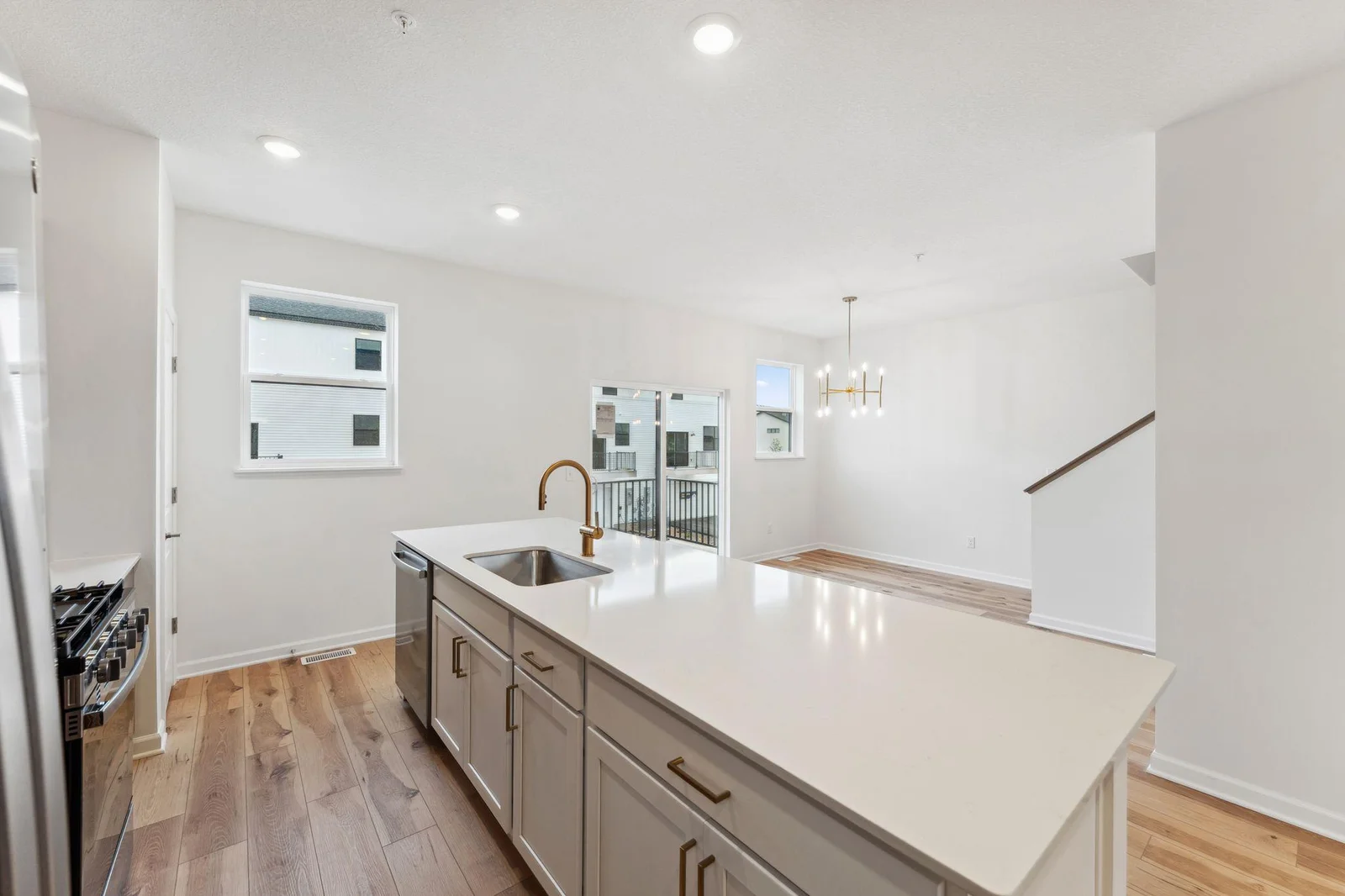 Kitchen with extended island with white cabinetry