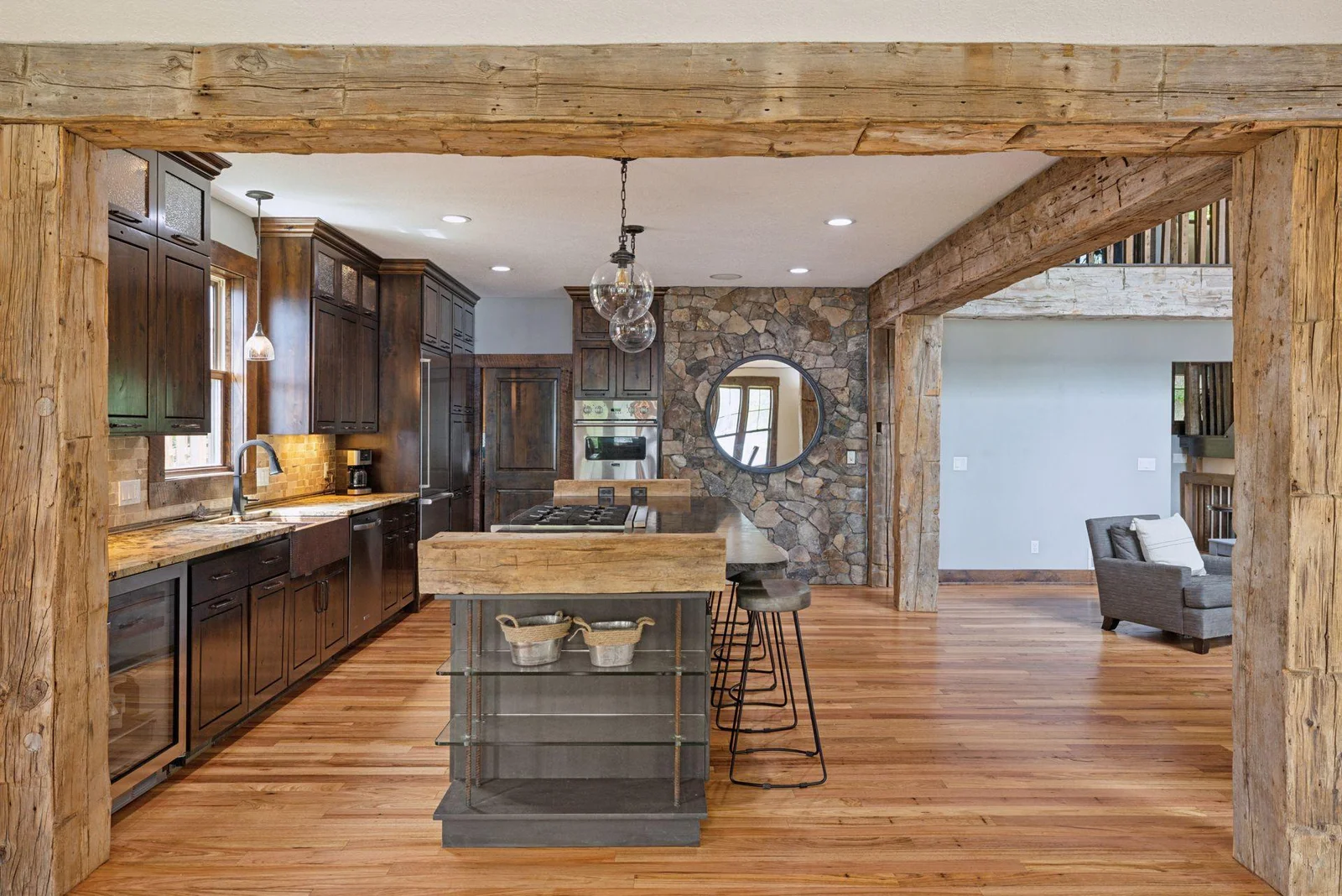Mesquite hardwood floors add character, together with a stone accent wall mirroring the fireplace wall.