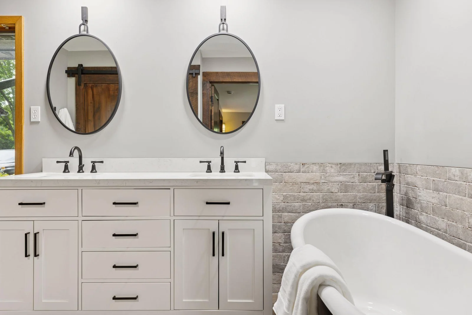 Main-floor primary bath complete with a soaking tub