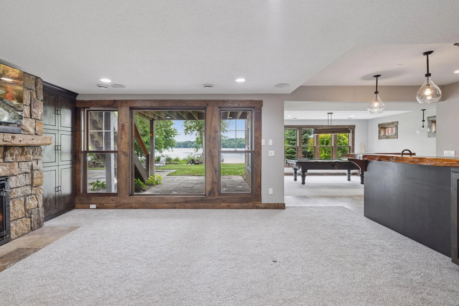 The lower-level amusement room is perfect for indoor/outdoor living.