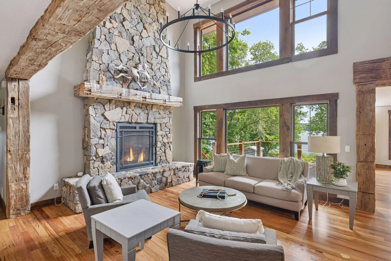 Show-stopping 22' stone fireplace with amazing lake views, are we in Colorado, or where are we?
