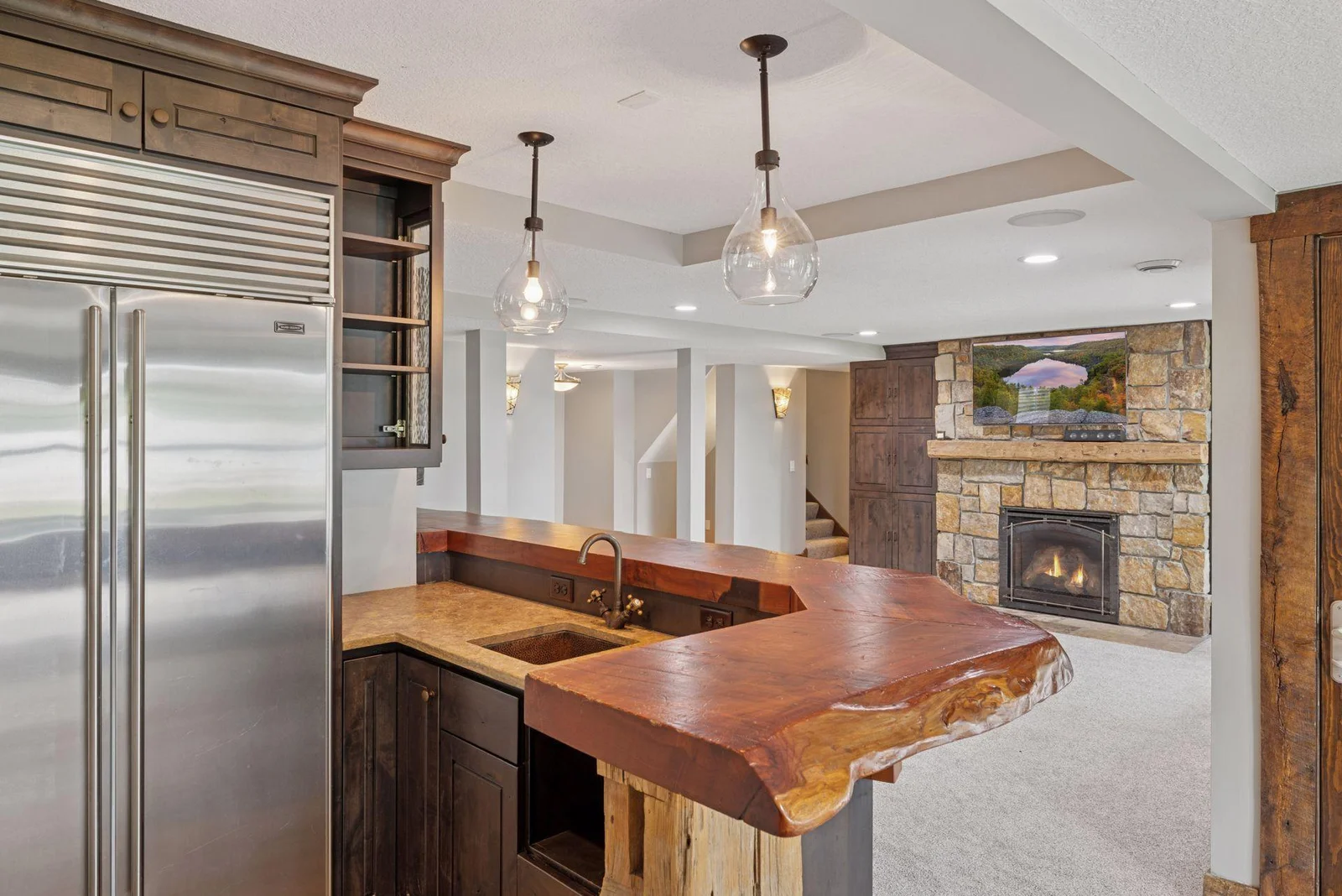 Redwood burl bar extends the width of the family room.