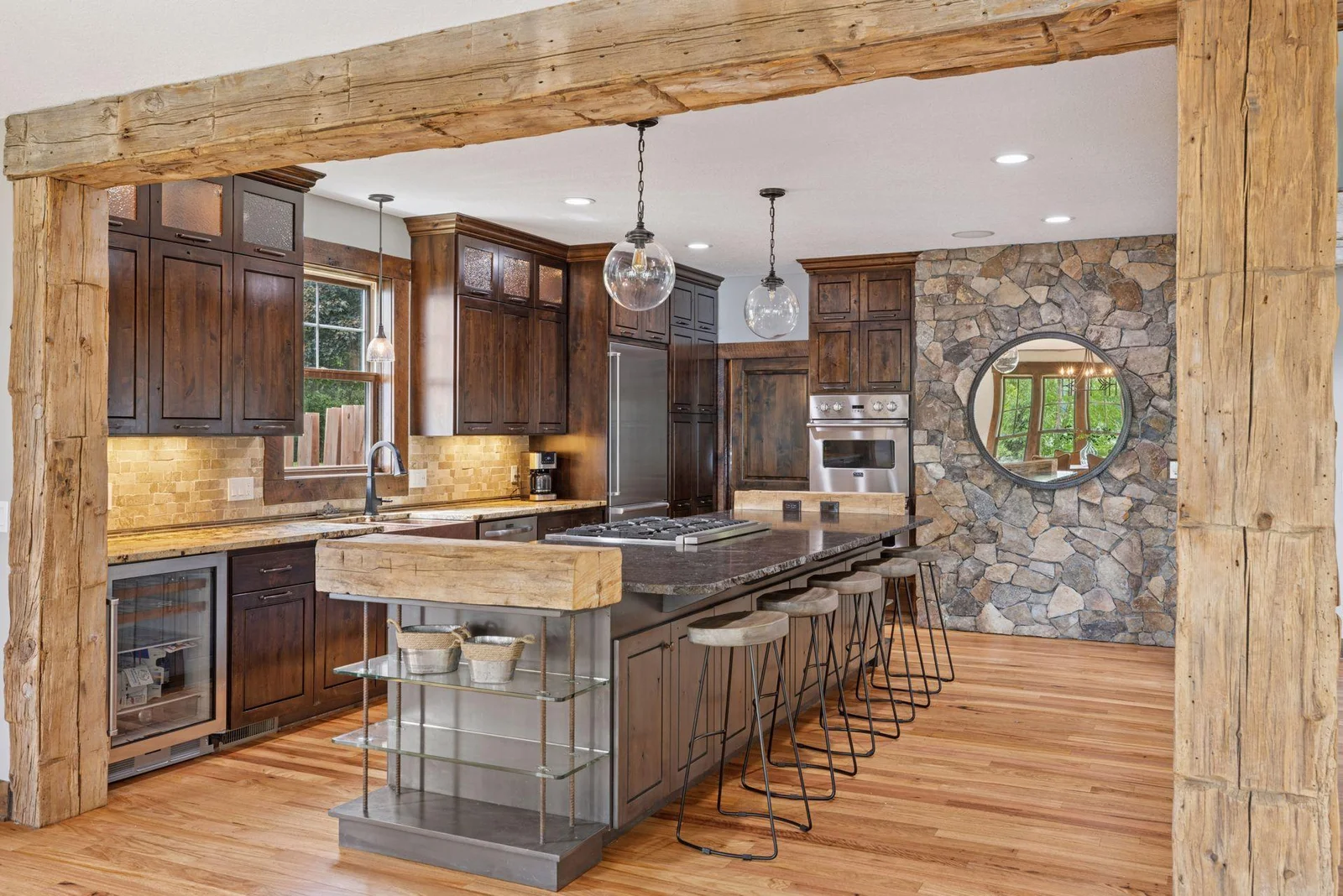Designer details, including the glass cabinets with lighting add a beautiful design detail.