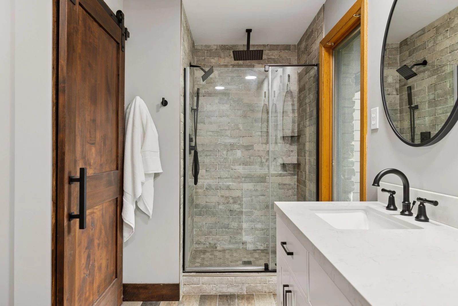 Separate shower with rainhead and larger soaking tub invite you to unwind at the end of the day.