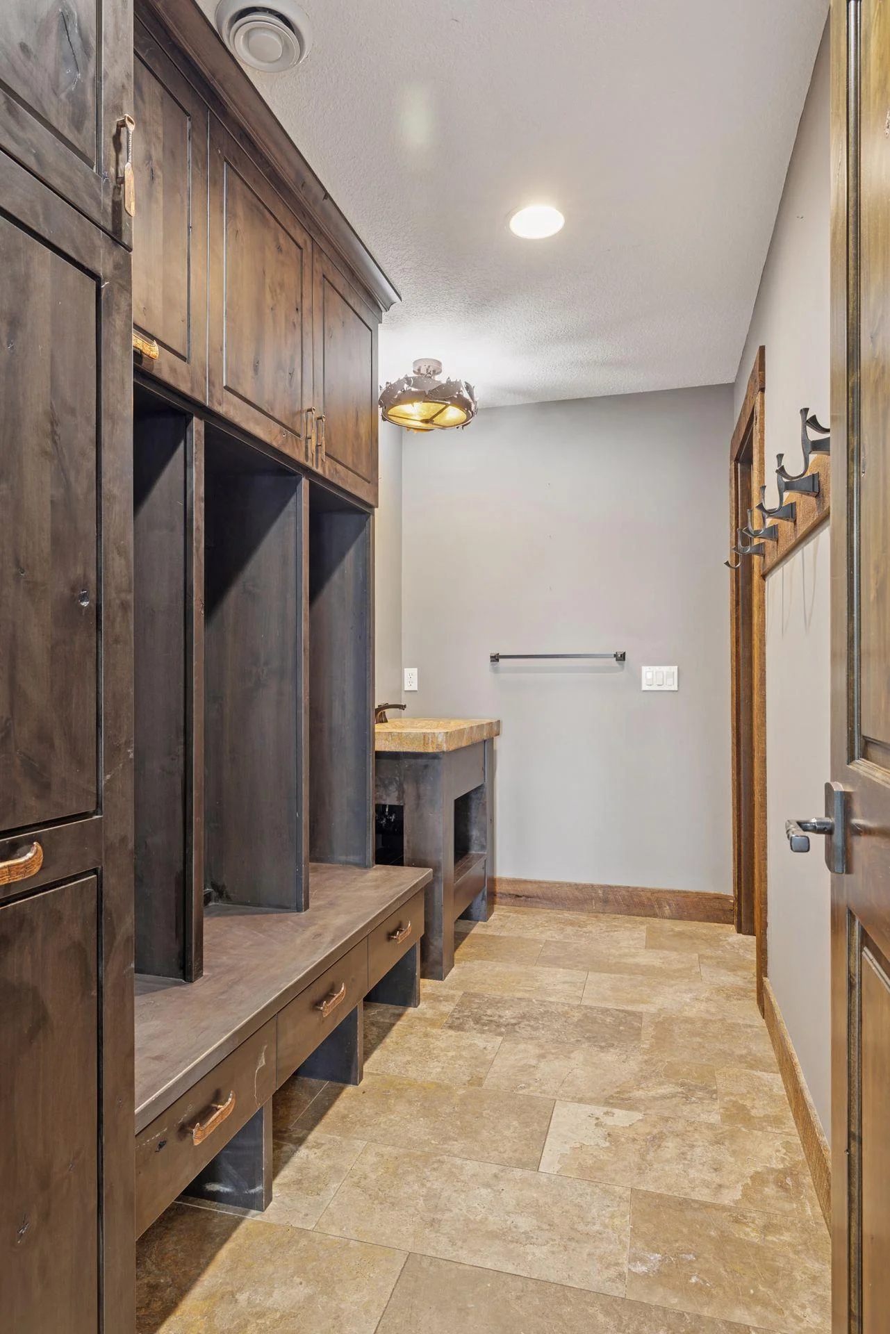 Lower-level lake room 3/4 bath with custom lockers for all of your lake gear and a place for towels and suits to dry.