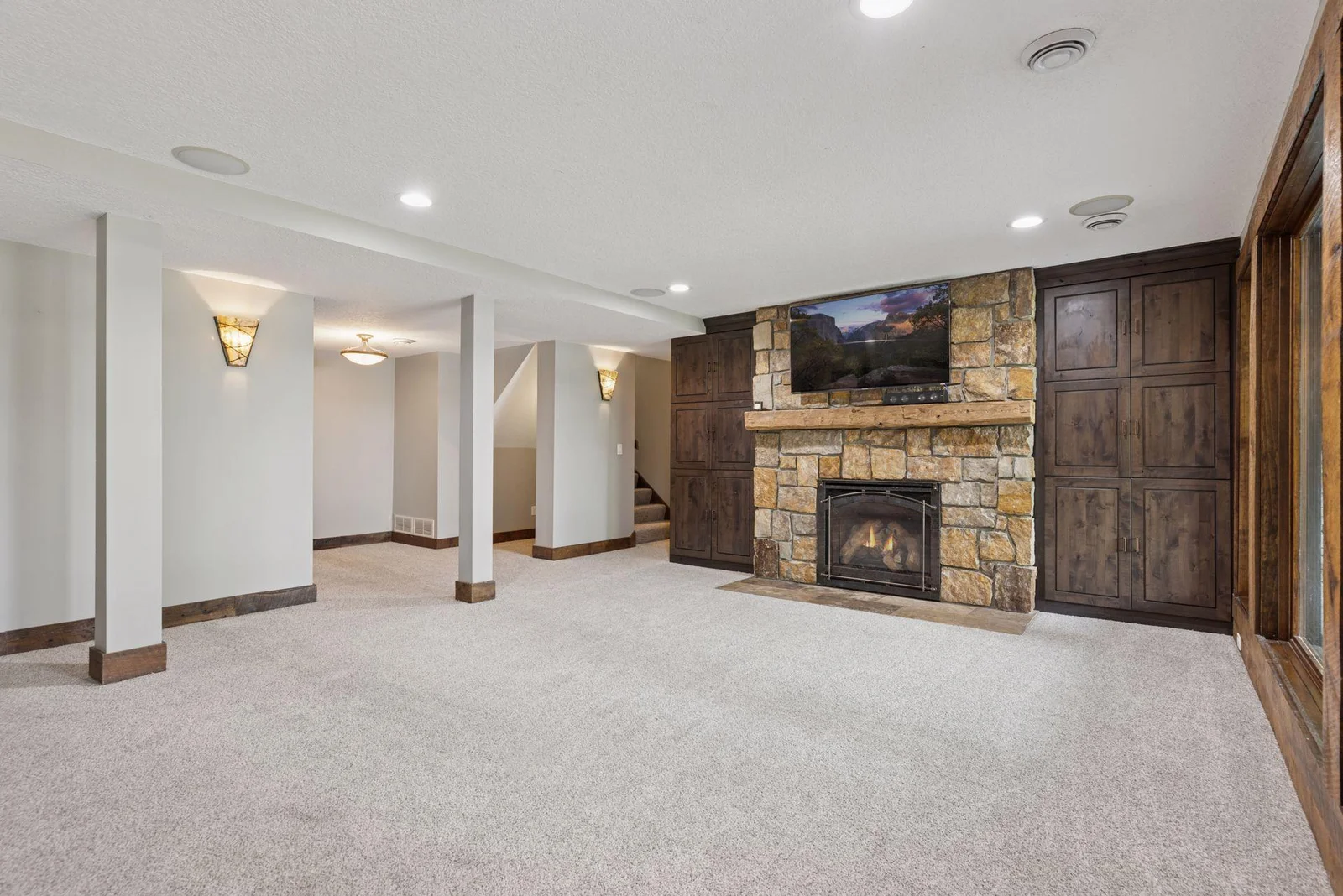Click on the gas fireplace for warmth and ambiance and enjoy custom built-ins flanking the fireplace.