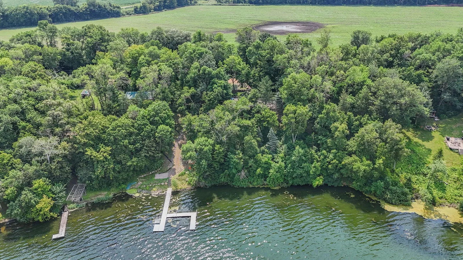 Nearly 1 acre and 240' of lakeshore