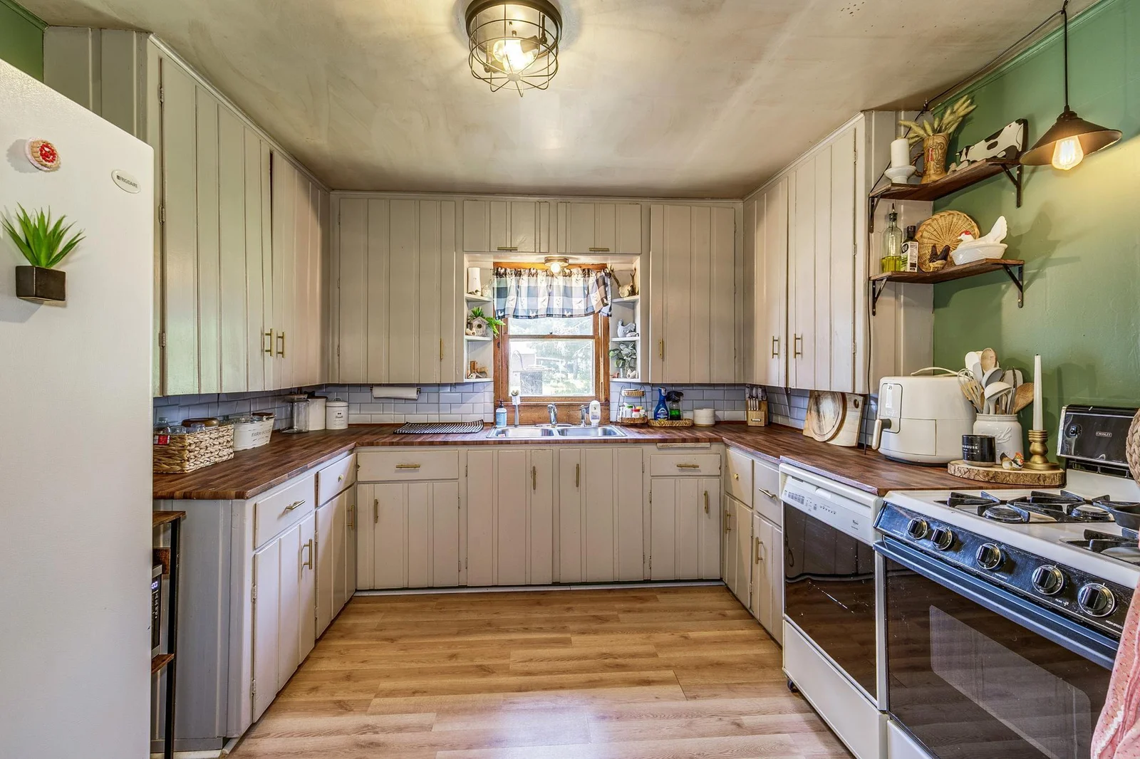 Kitchen with many cabinets and counter space