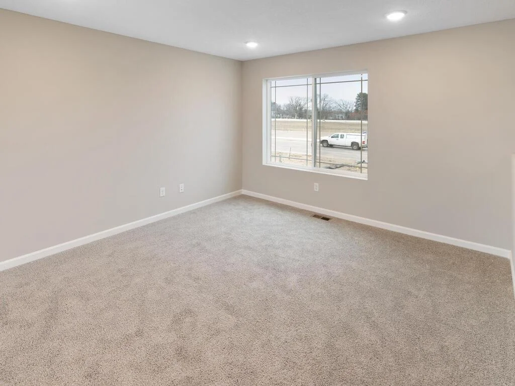 Living Room. Photo is taken of another home with similar plan and finishes.