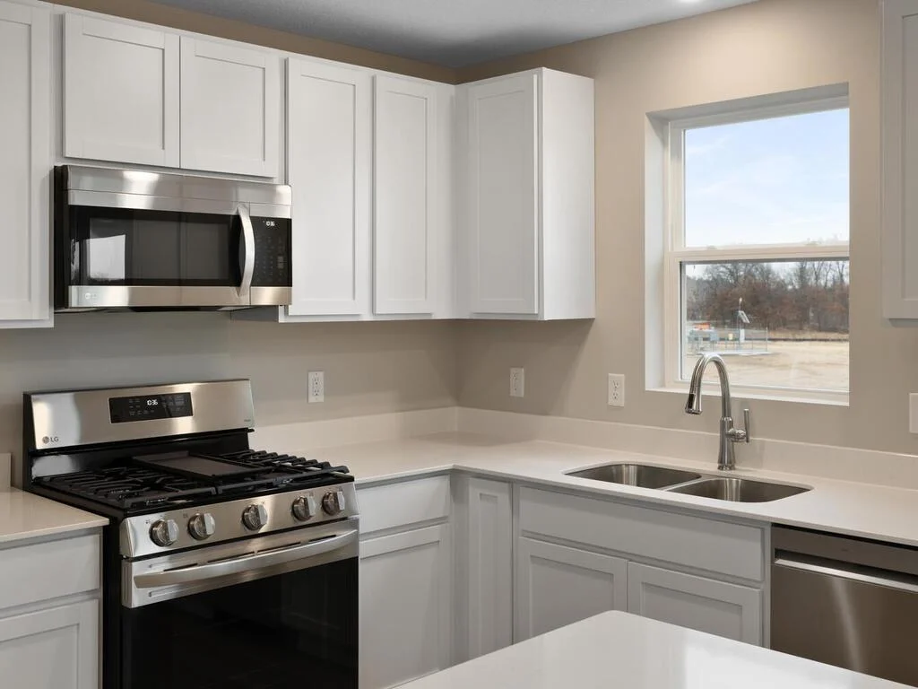 Kitchen. Photo is taken of another home with similar plan and finishes.