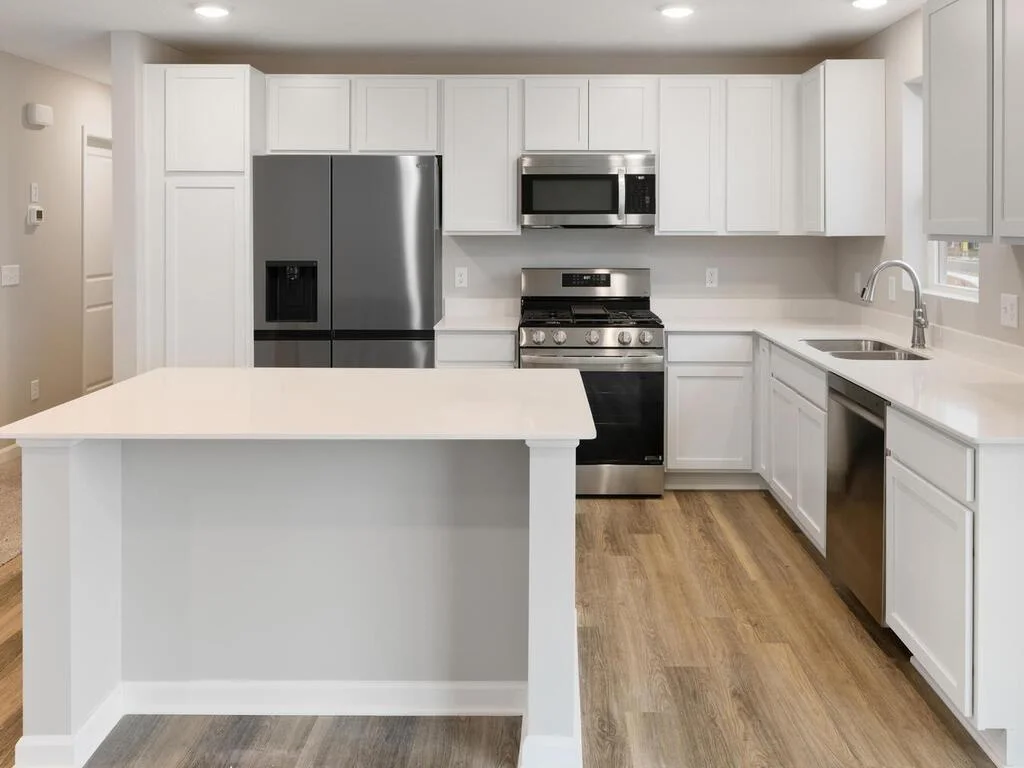 Kitchen. Photo is taken of another home with similar plan and finishes.