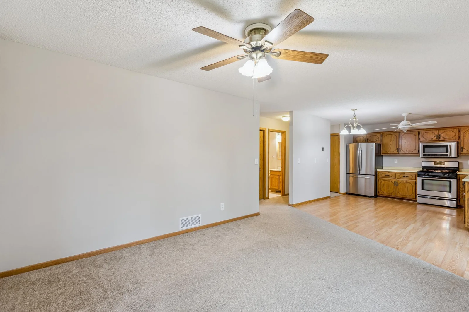 Looking into the hallway and kitchen from the living room