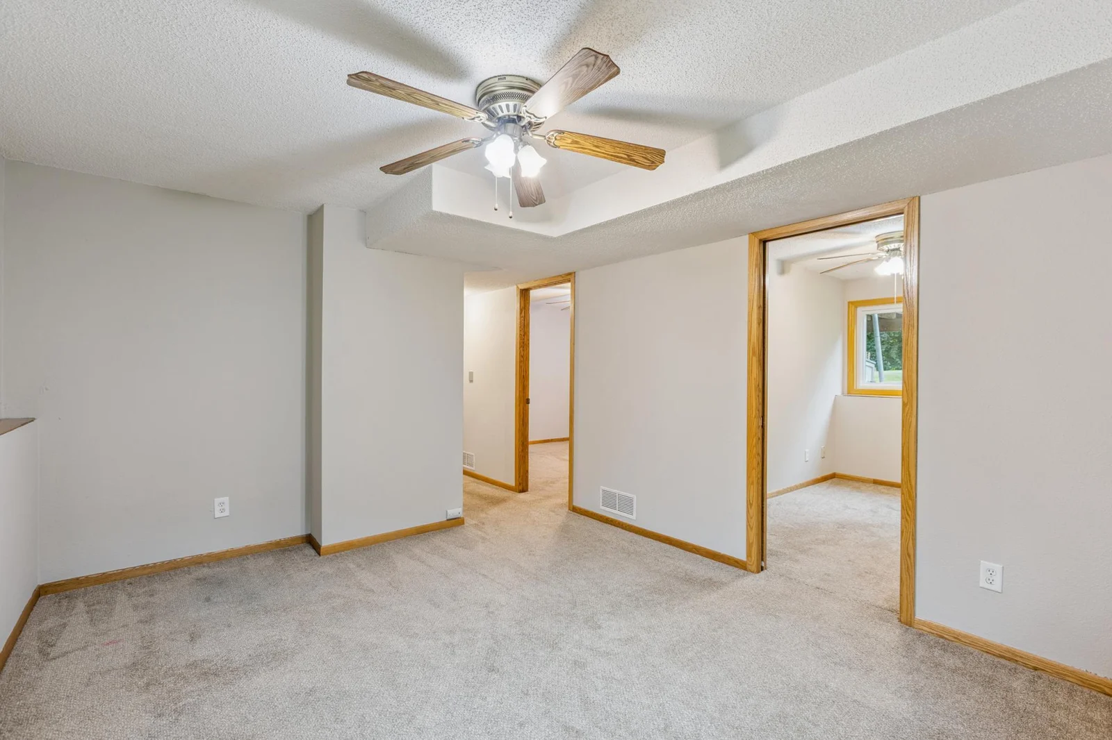 View from the family room looking into the two lower level bedrooms