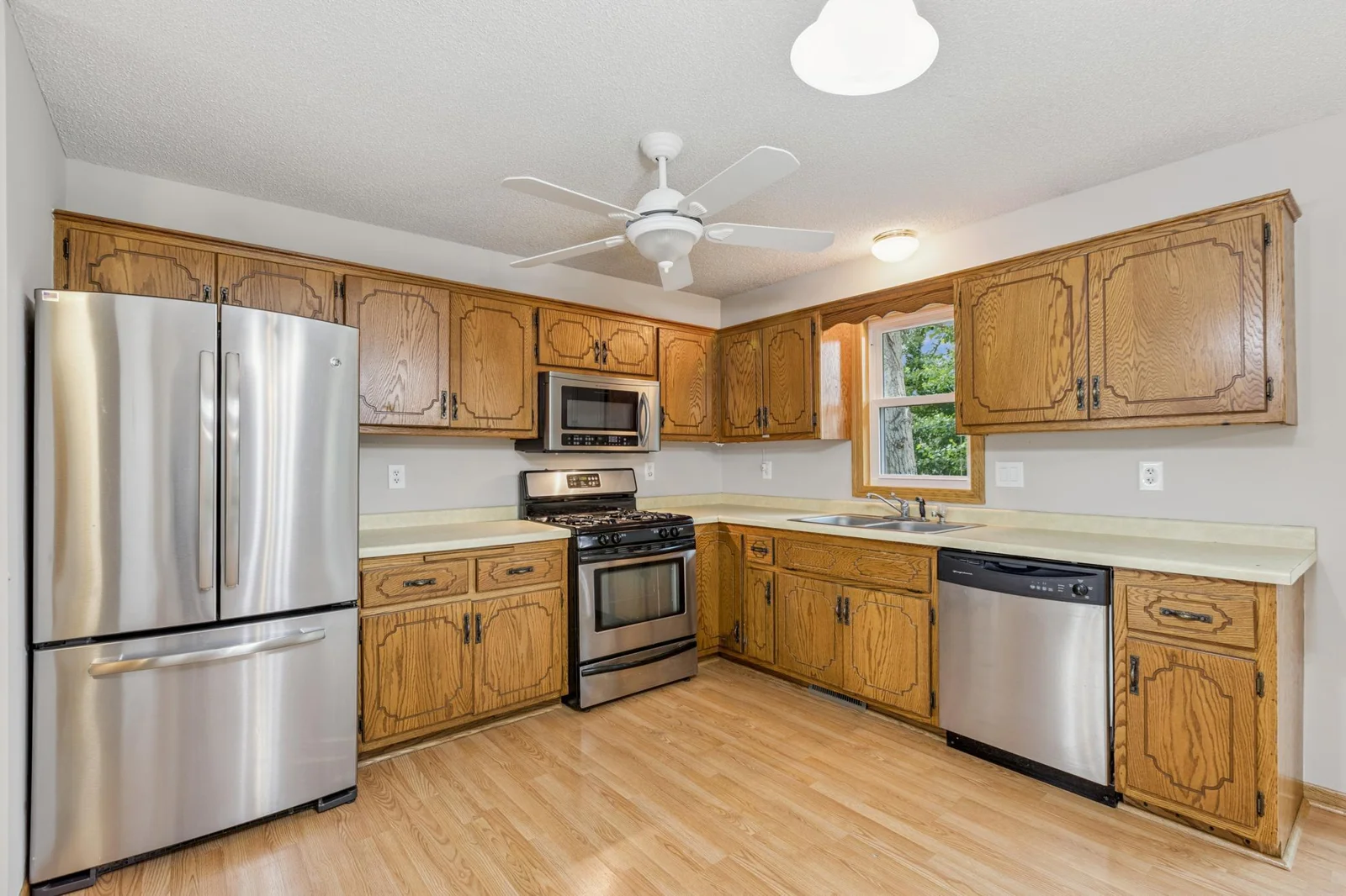 The kitchen features stainless appliances