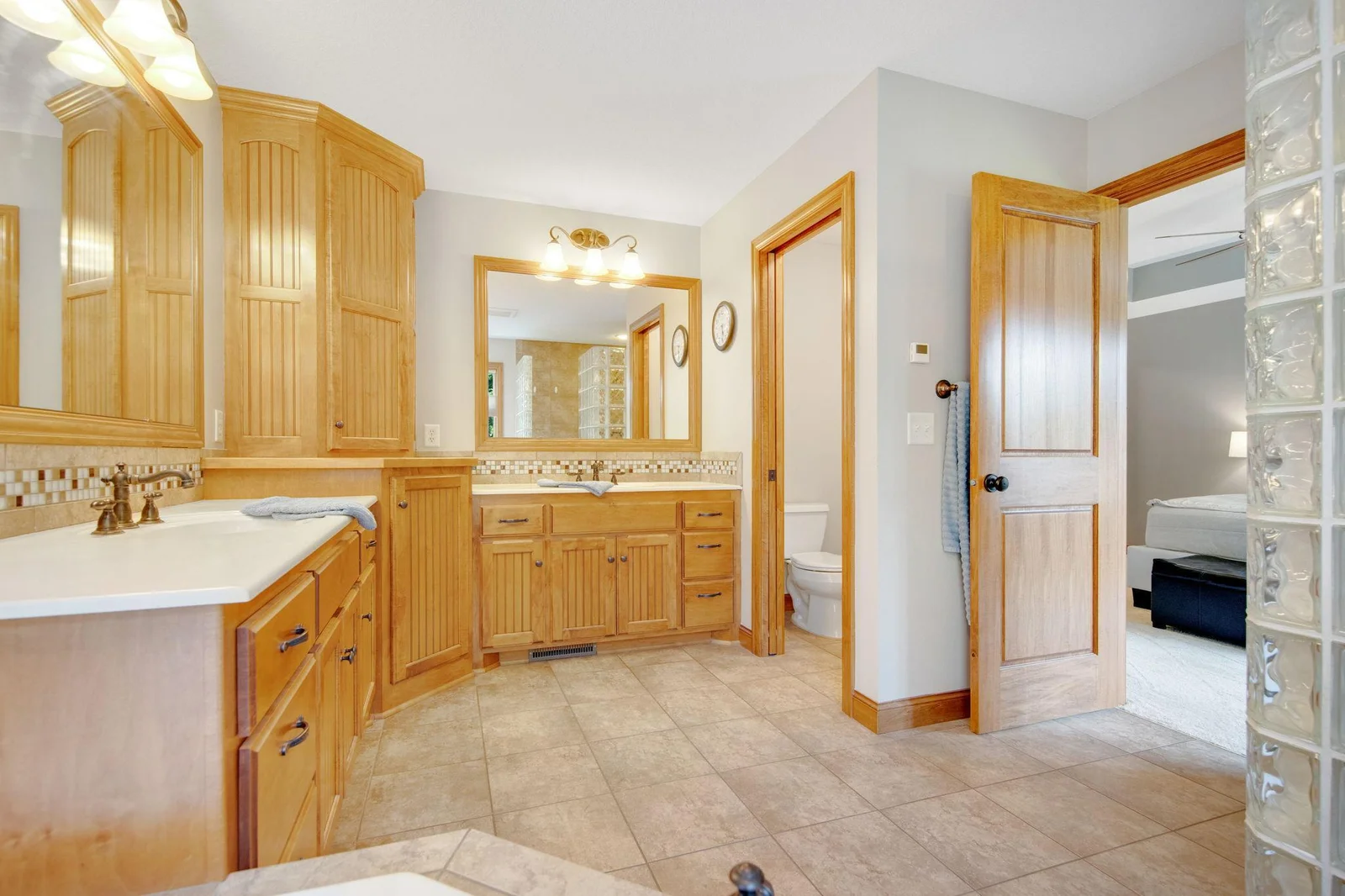 Primary private bathroom with dual vanities.