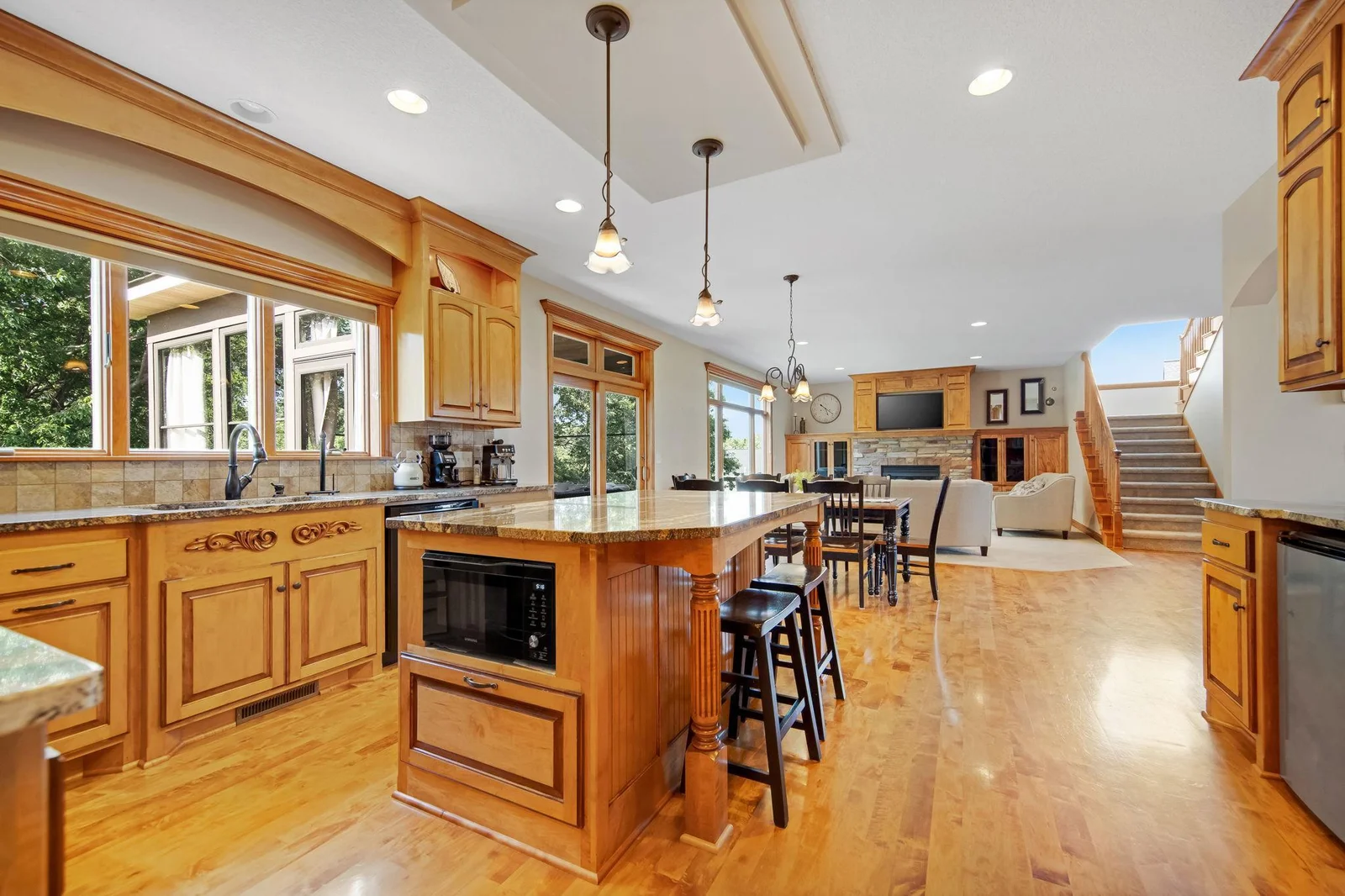Stunning maple flooring throughout the main.