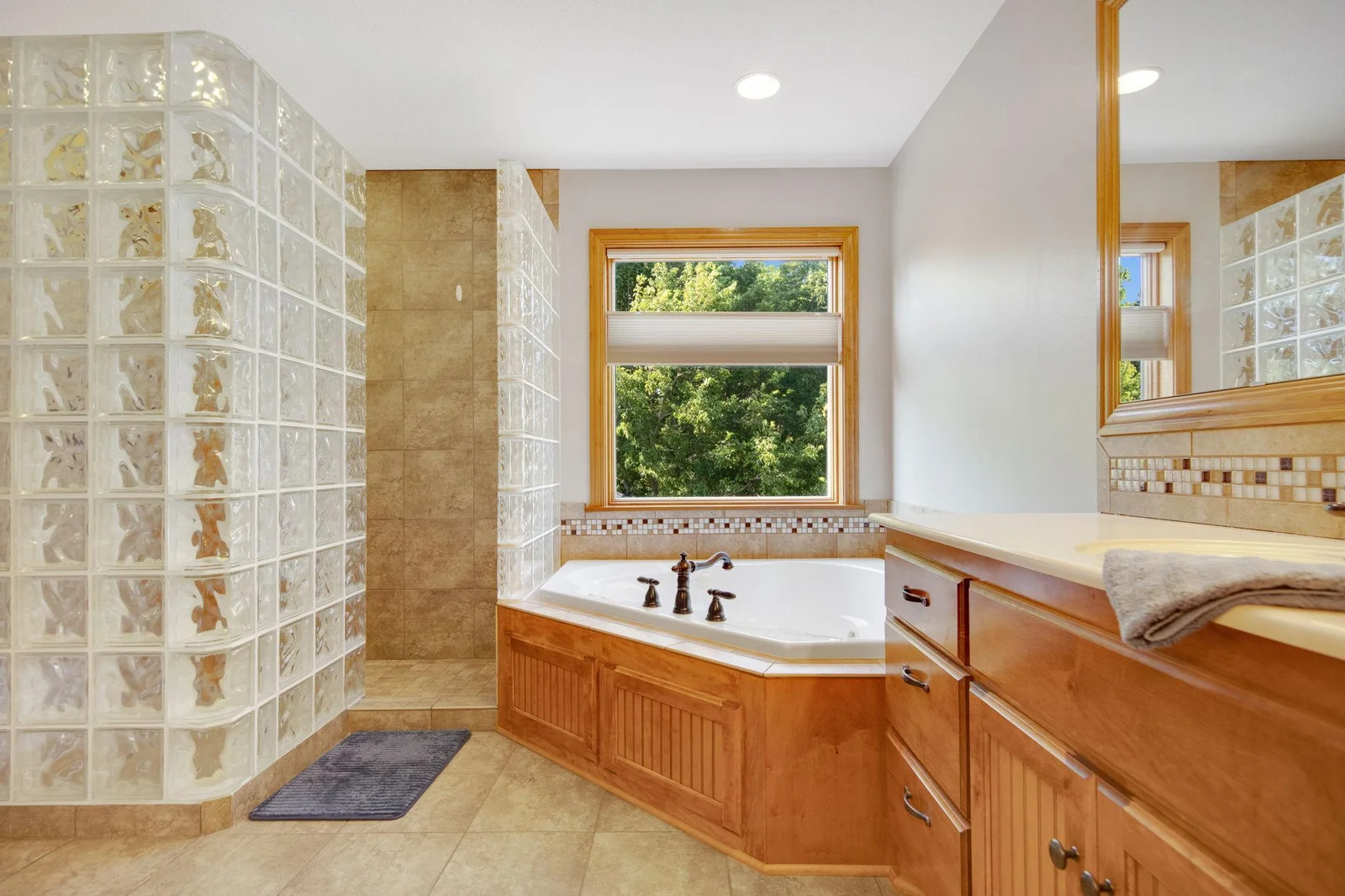 Large soaker tub and tile walk-in shower.