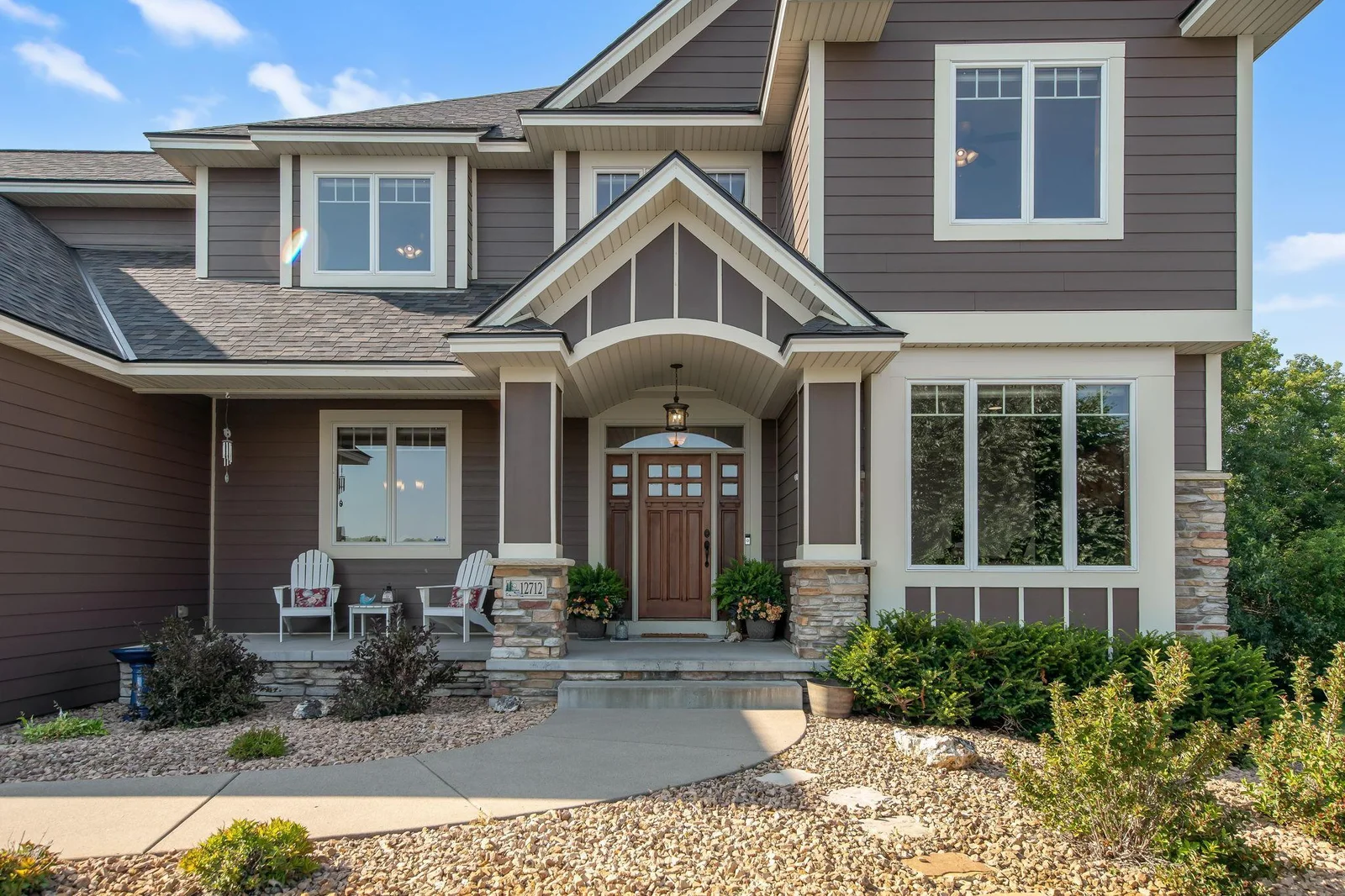 Every luxury custom built home needs an inviting front porch- and this one has just that!