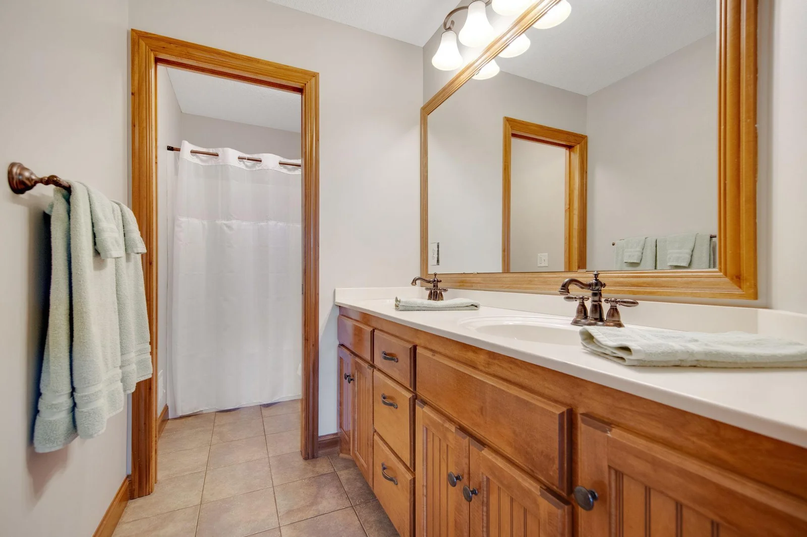 Upper level full bathroom. Double sinks and private shower area.