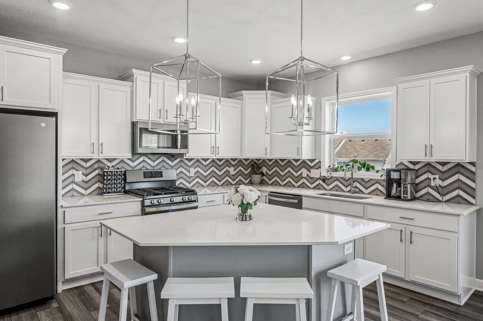 Kitchen with massive island, and beautiful lookout window at sink