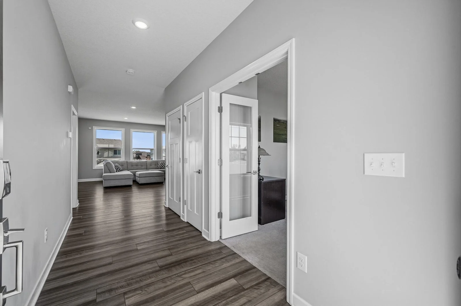 Large, bright, and welcoming entry with a coat closet and front office