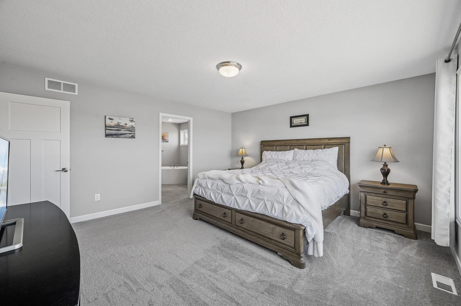Large primary bedroom with private en-suite and huge walk-in closet