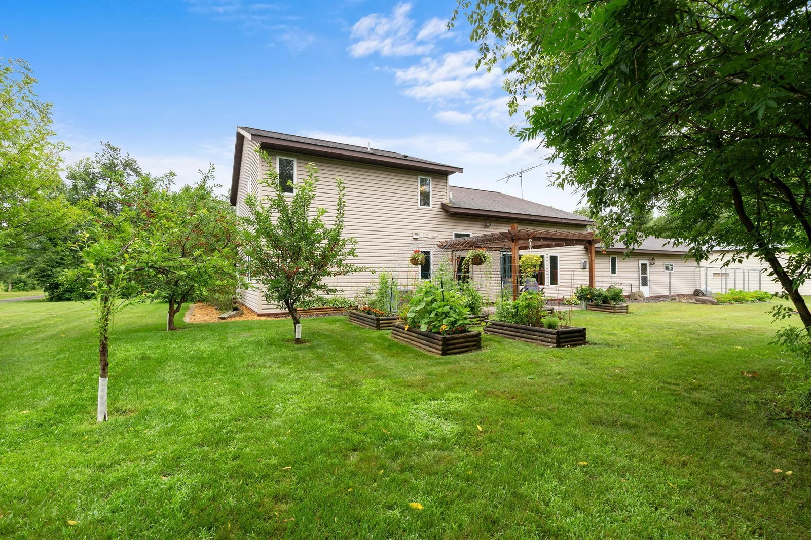 Multiple fruit trees & raised garden beds