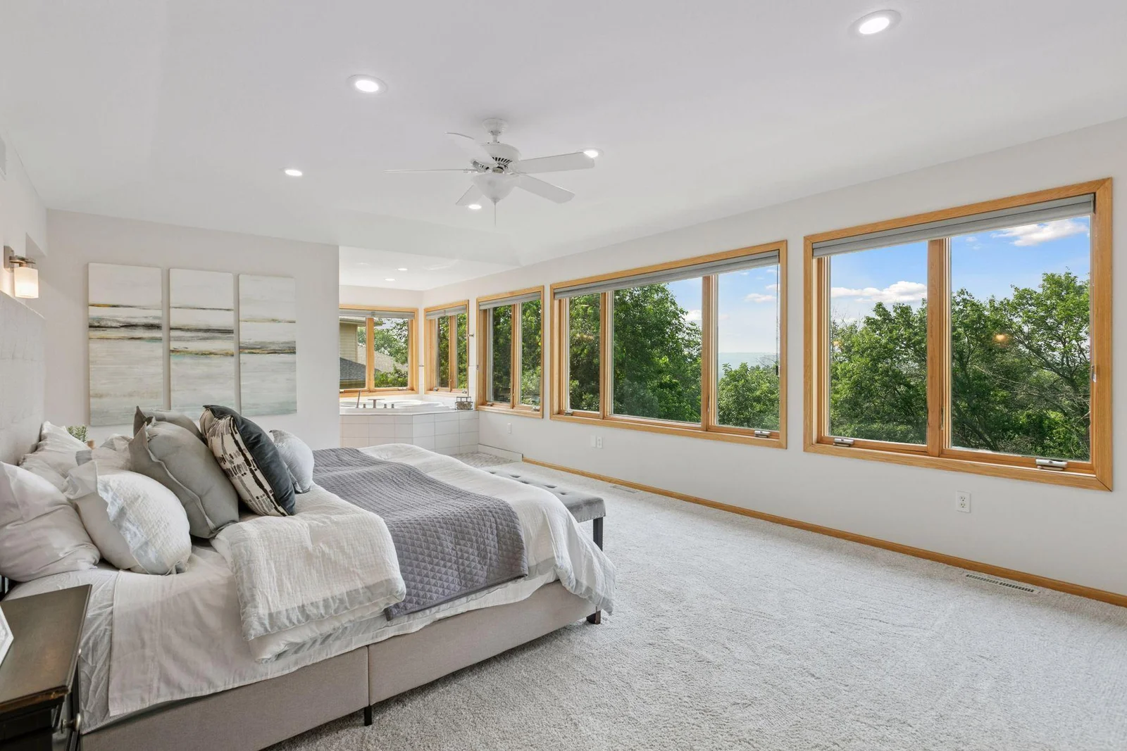 A one-of-a-kind primary suite with expansive views over the Minnesota River Valley and night sky