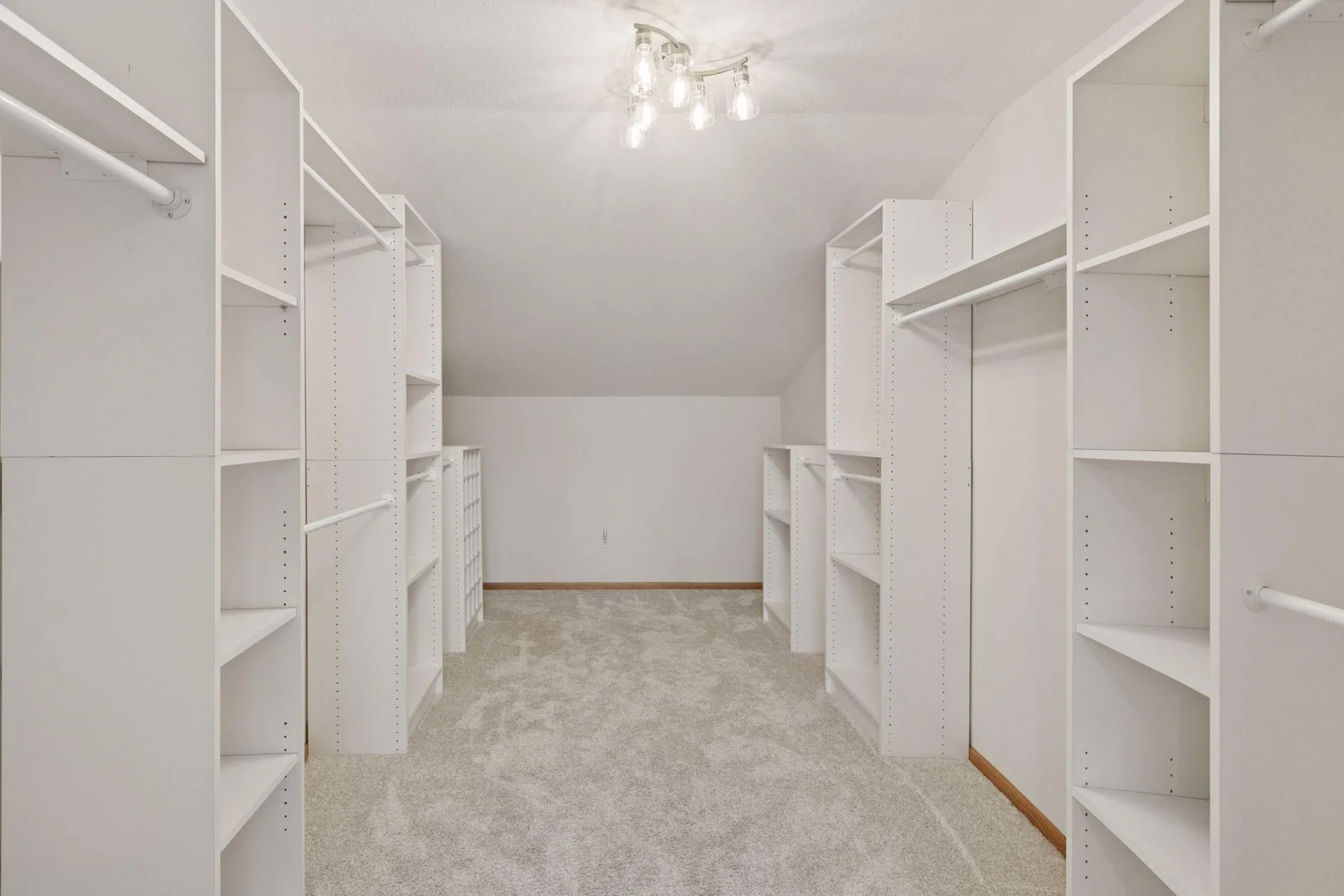 The primary suite has an incredibly spacious walk-in closet