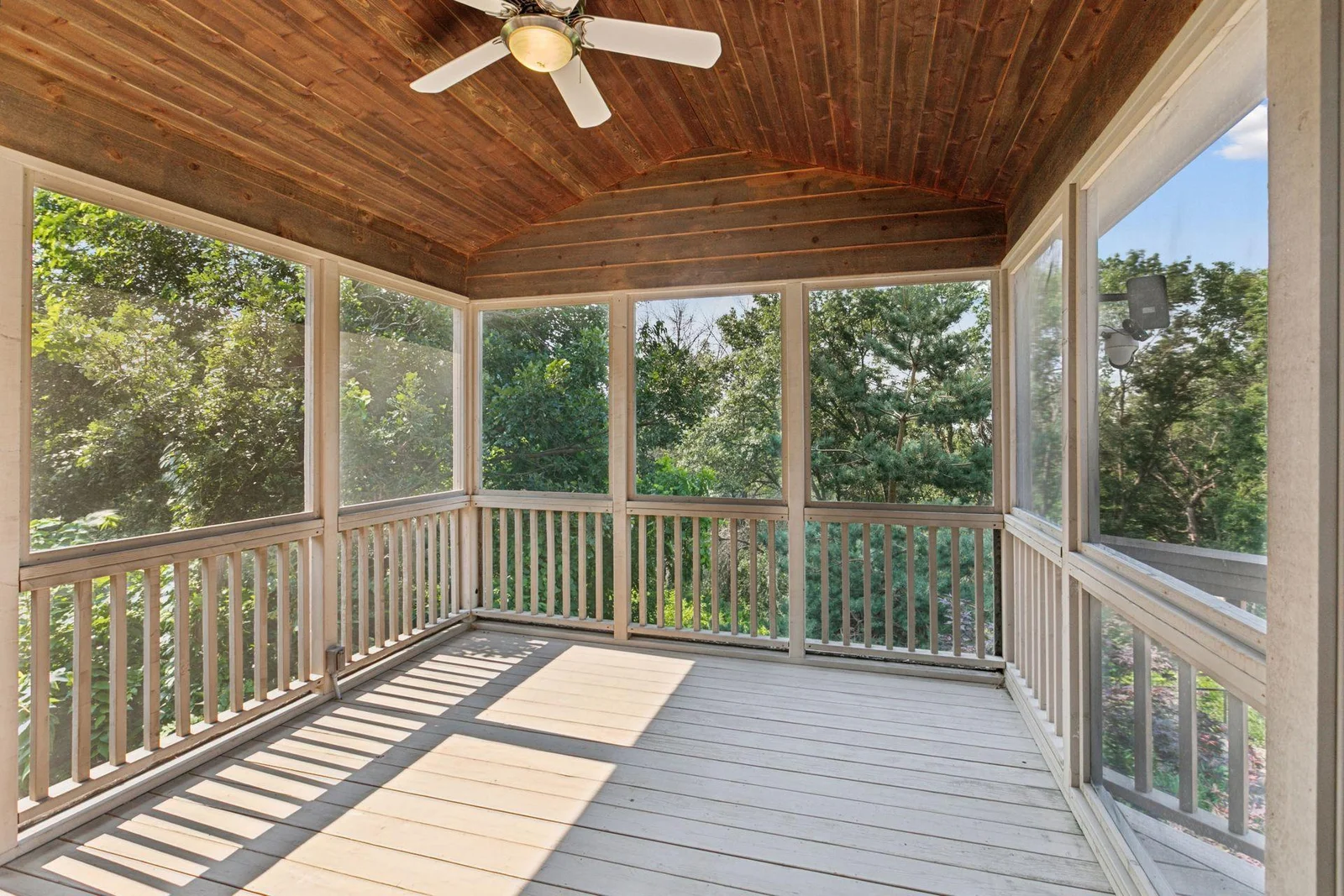 Covered three-season, elevated porch that walks out to the deck