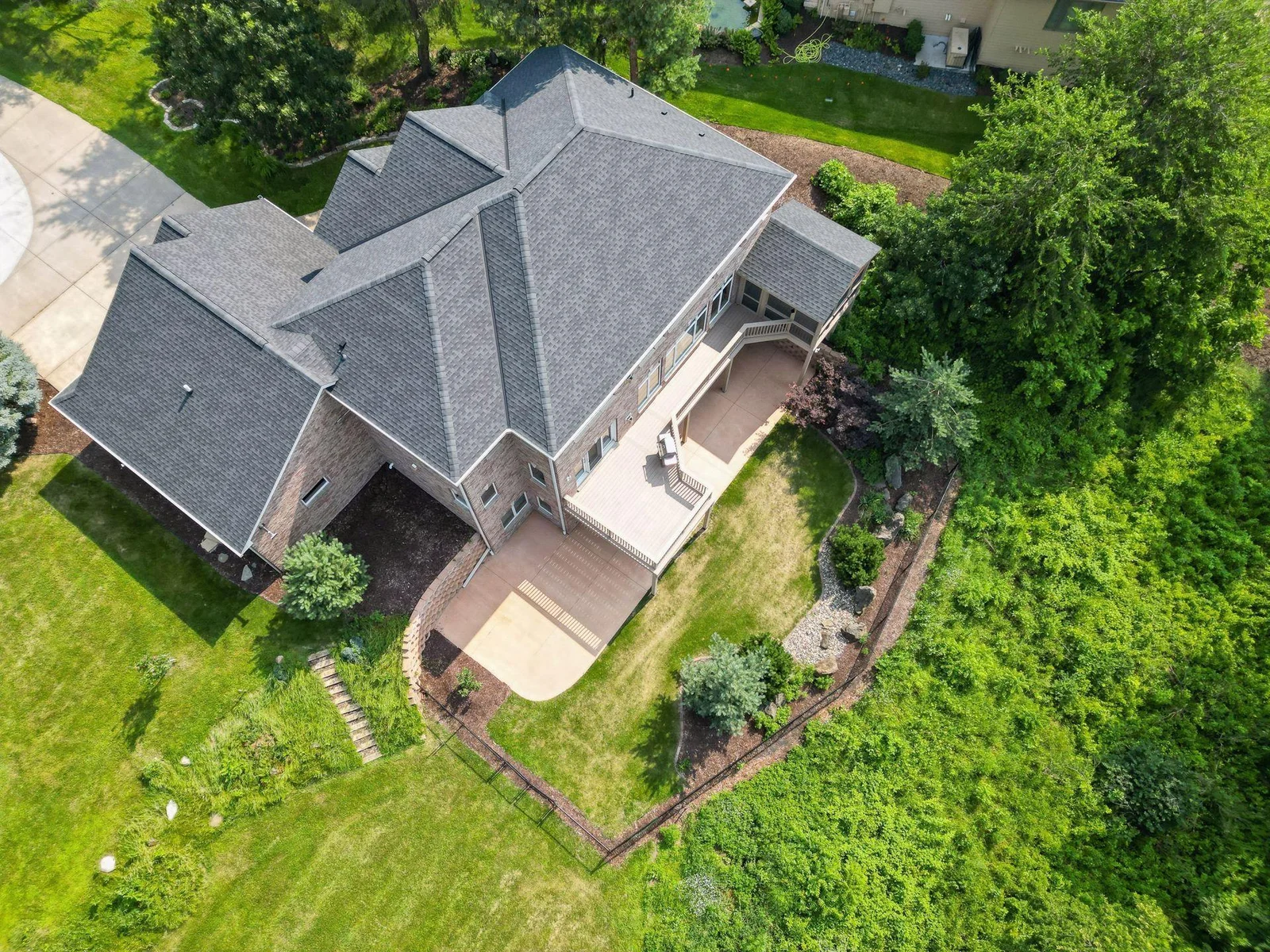 New roof in 2023 with 40-year shingles; new back patio and landscaping in 2024
