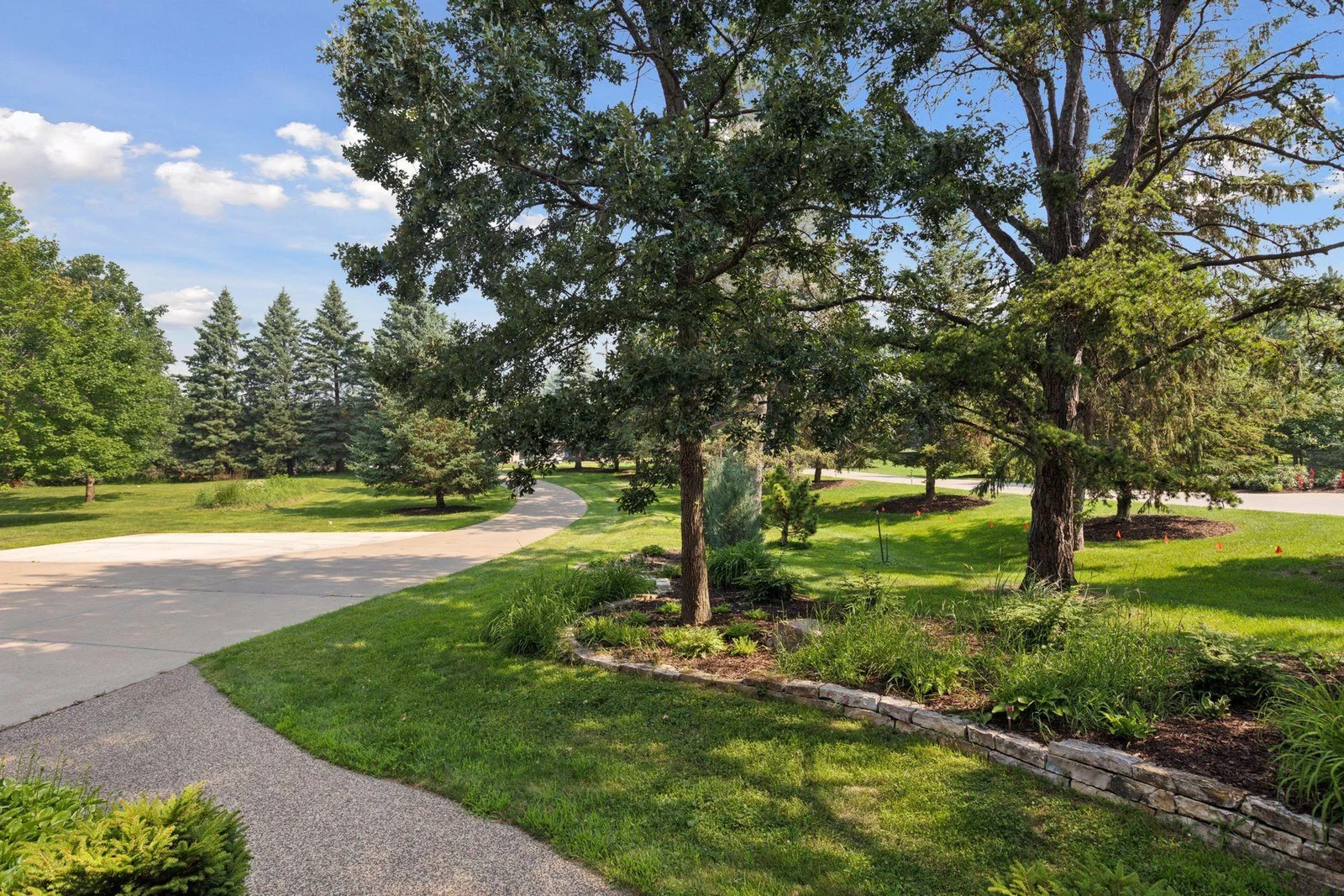 Lush landscaping and mature trees bring privacy and senerety