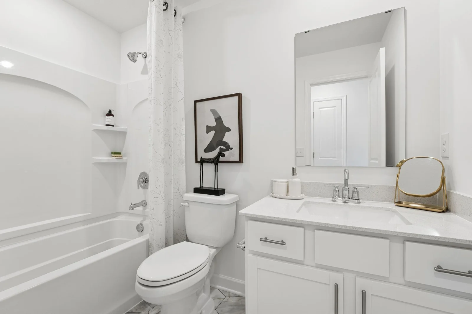 (Photo of a model home. Finishes and features will vary) The full secondary bathroom.
