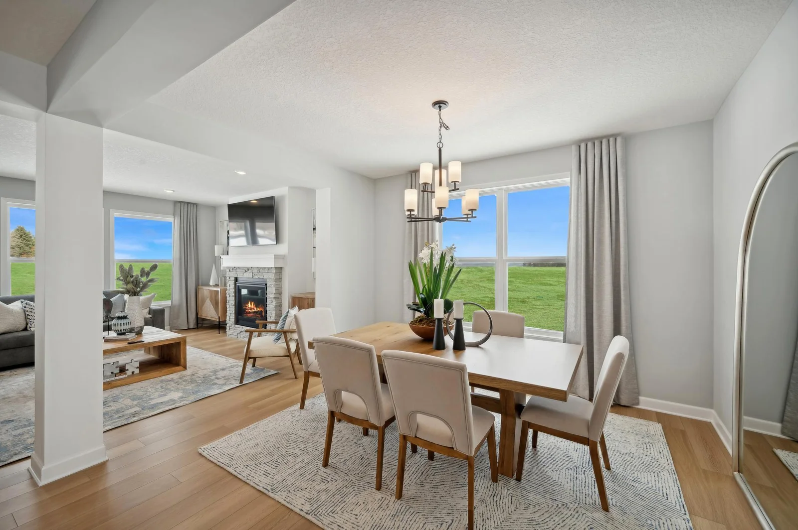 (Photo of a decorated model, actual homes finishes will vary) This formal dining area is large enough to comfortably accommodate a 10-seat dining room table.