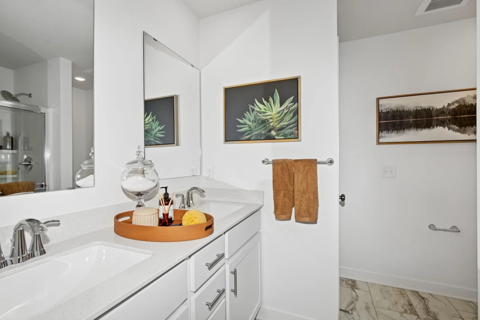 *Photo of model home, actual features may vary. An extension of the owner's suite, this private and spacious bathroom contains a double-vanity.