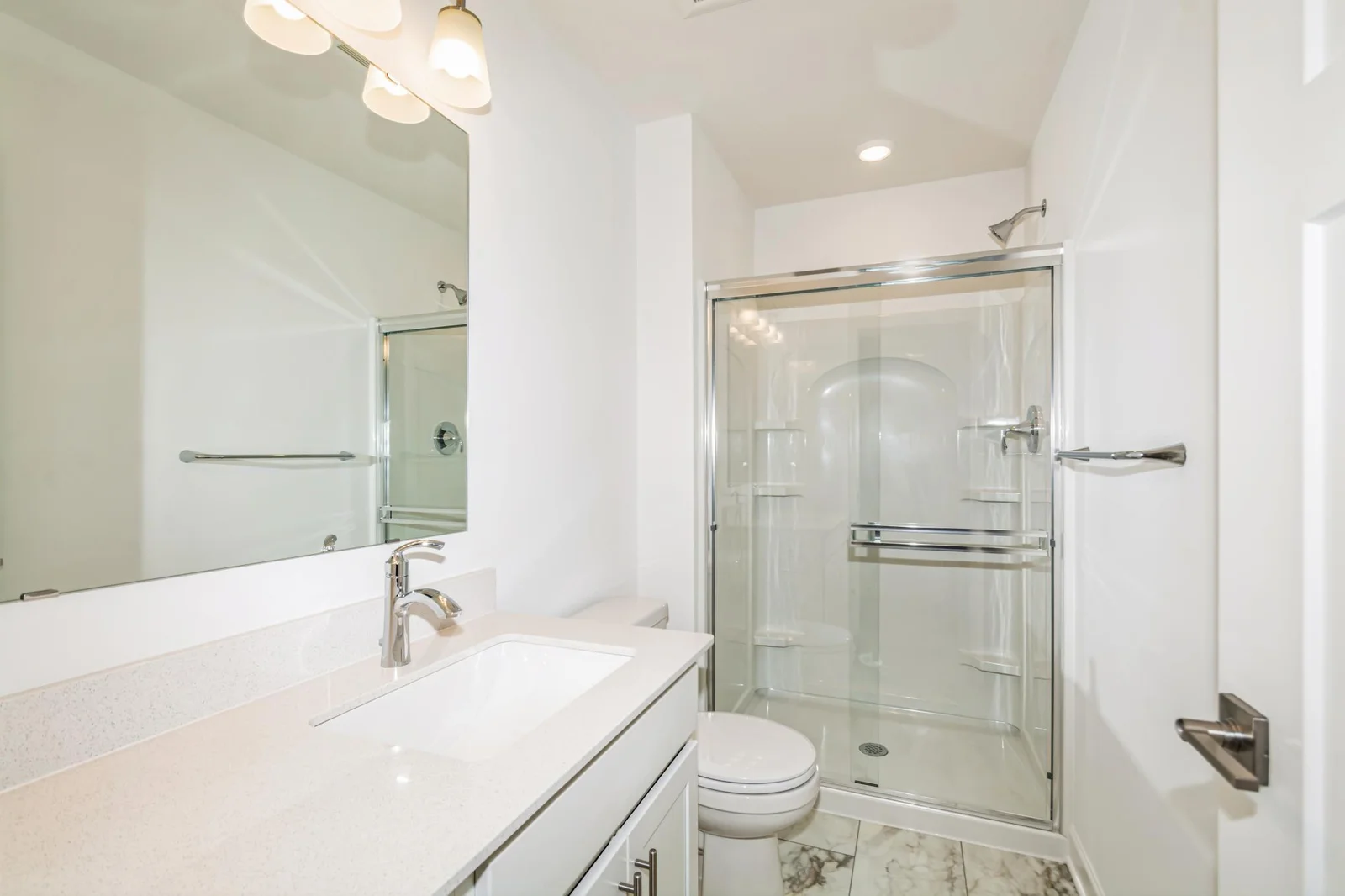 Photo is of the actual home. One of the secondary bedrooms has its own private bath!