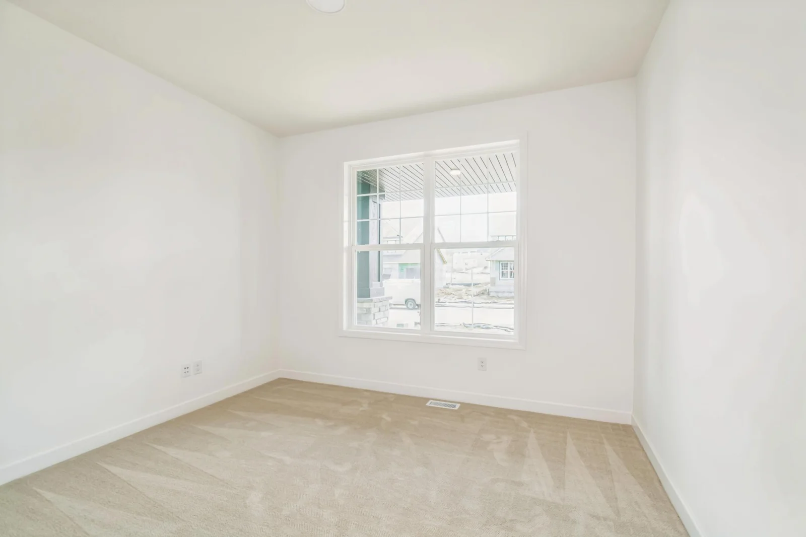 Photo is of the actual home. The main level flex room.