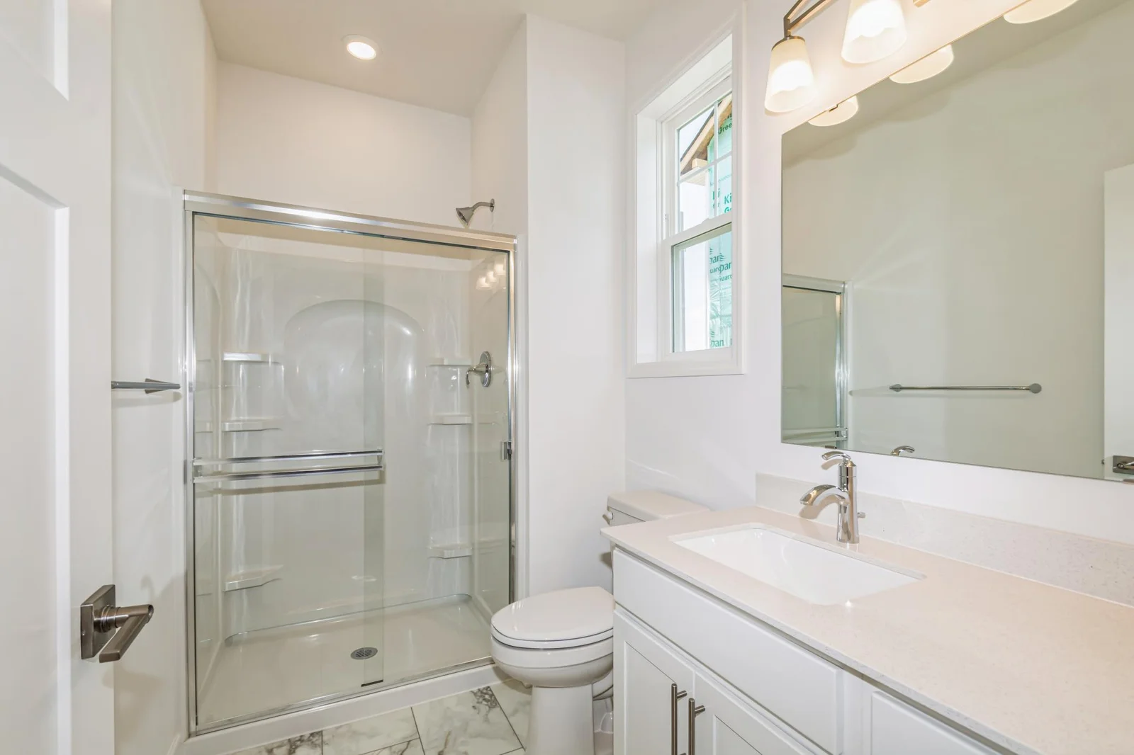 Photo is of the actual home. The main level bath.