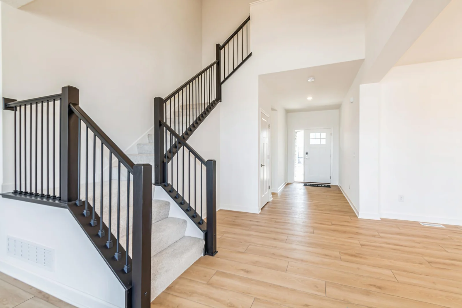 Photo is of the actual home. Make the best first impression with this bright and open foyer.