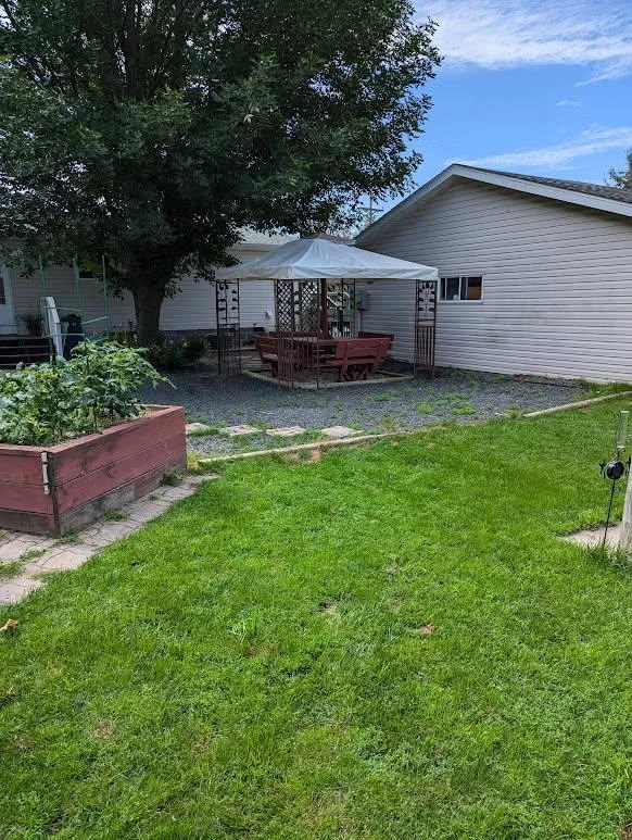 shaded sitting area in backyard