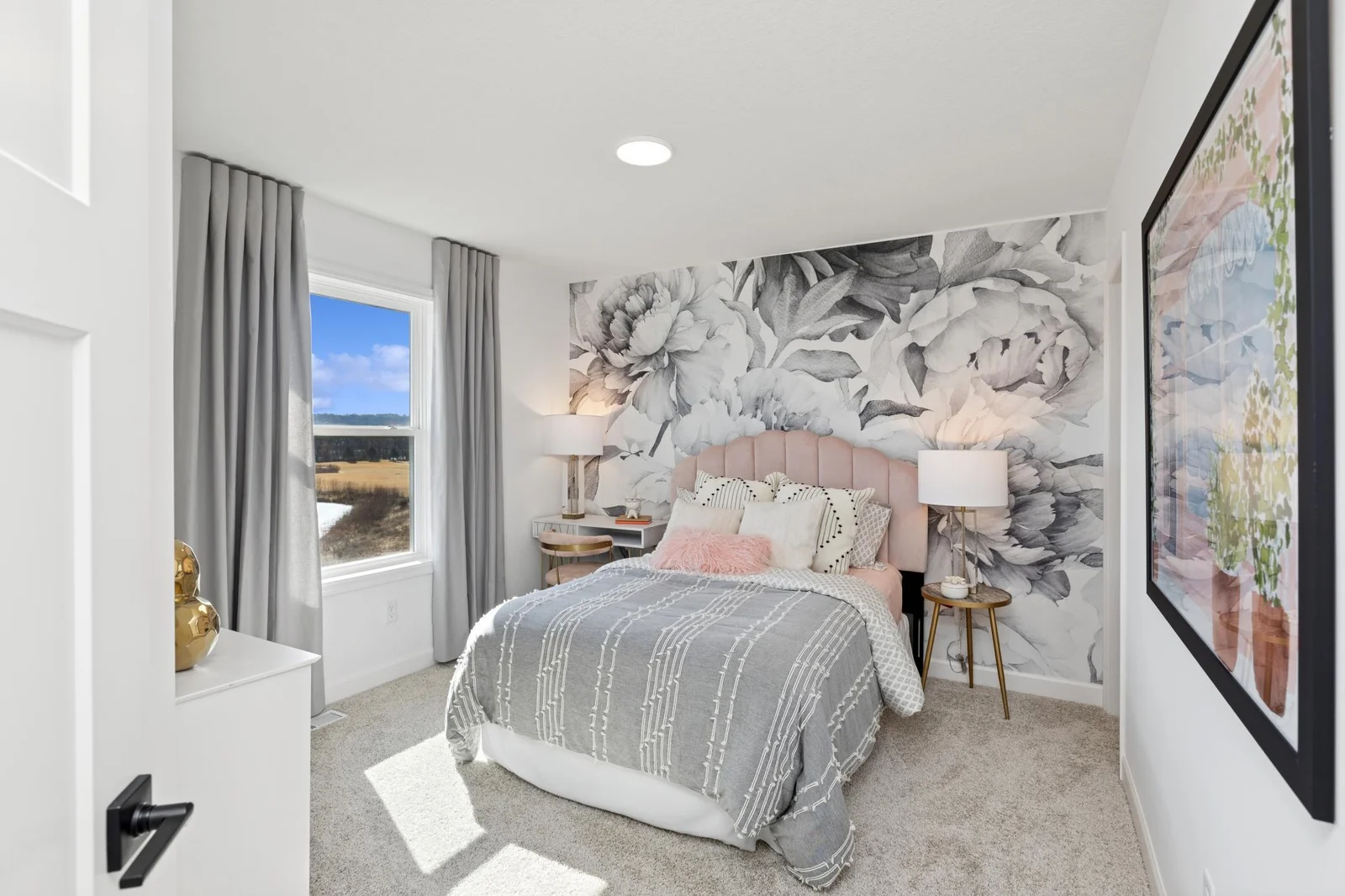 (Photo of a decorated model home, features and finishings will vary) One of the spacious secondary bedrooms.