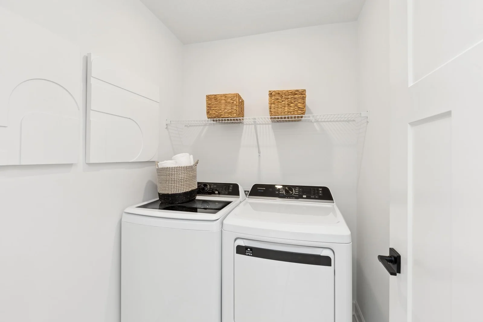 (Photo of a decorated model home, features and finishings will vary) The laundry room is located on the upper floor for convenience.
